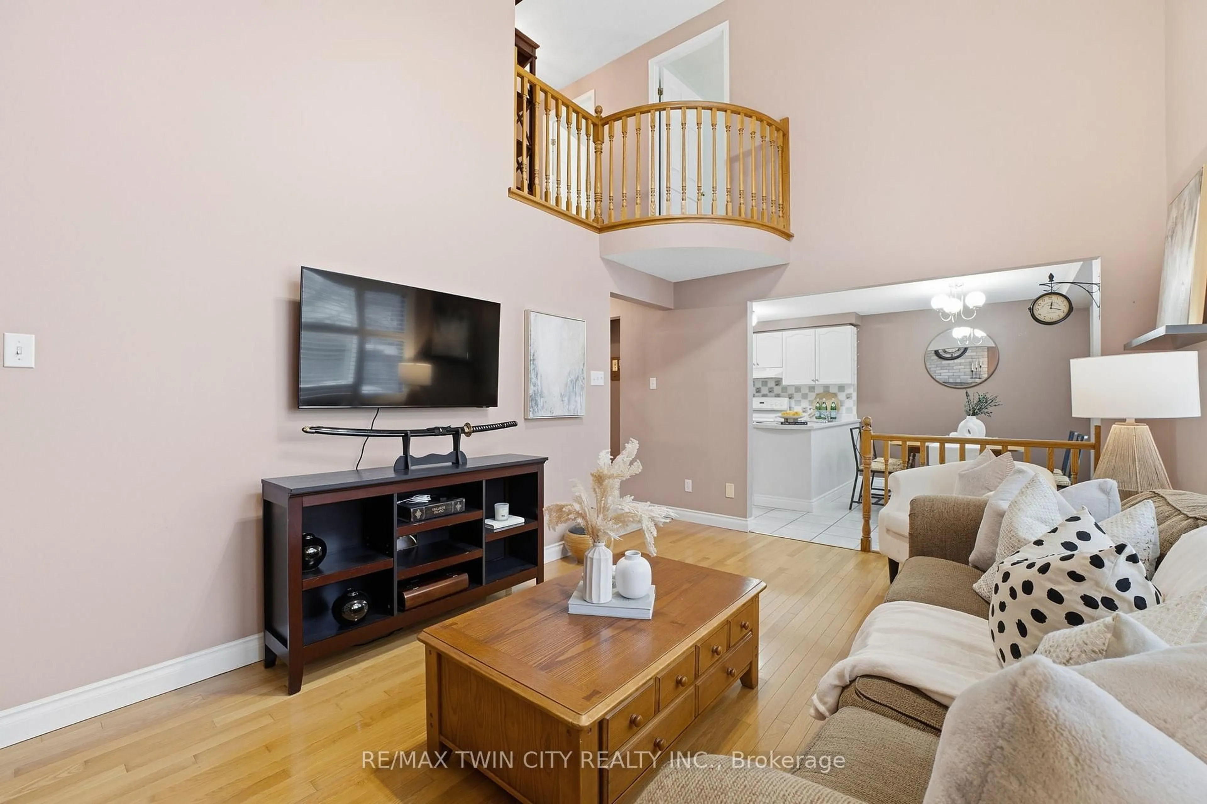 Living room with furniture, wood/laminate floor for 68 Fairlake Dr, Cambridge Ontario N1S 4Z3