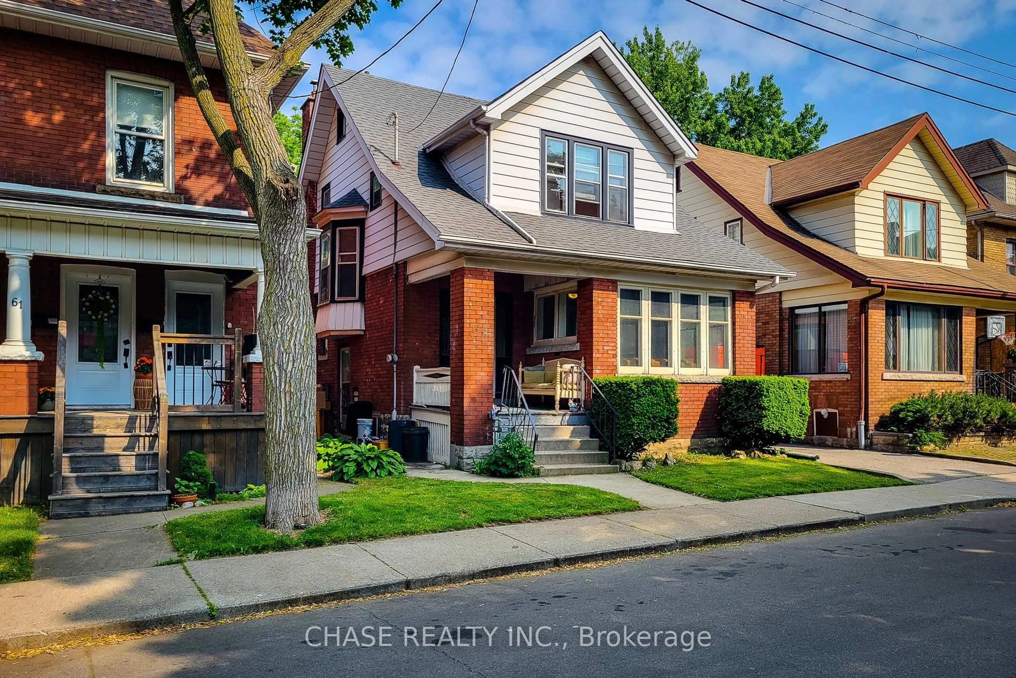 Home with brick exterior material, street for 63 Carrick Ave, Hamilton Ontario L8M 2W4