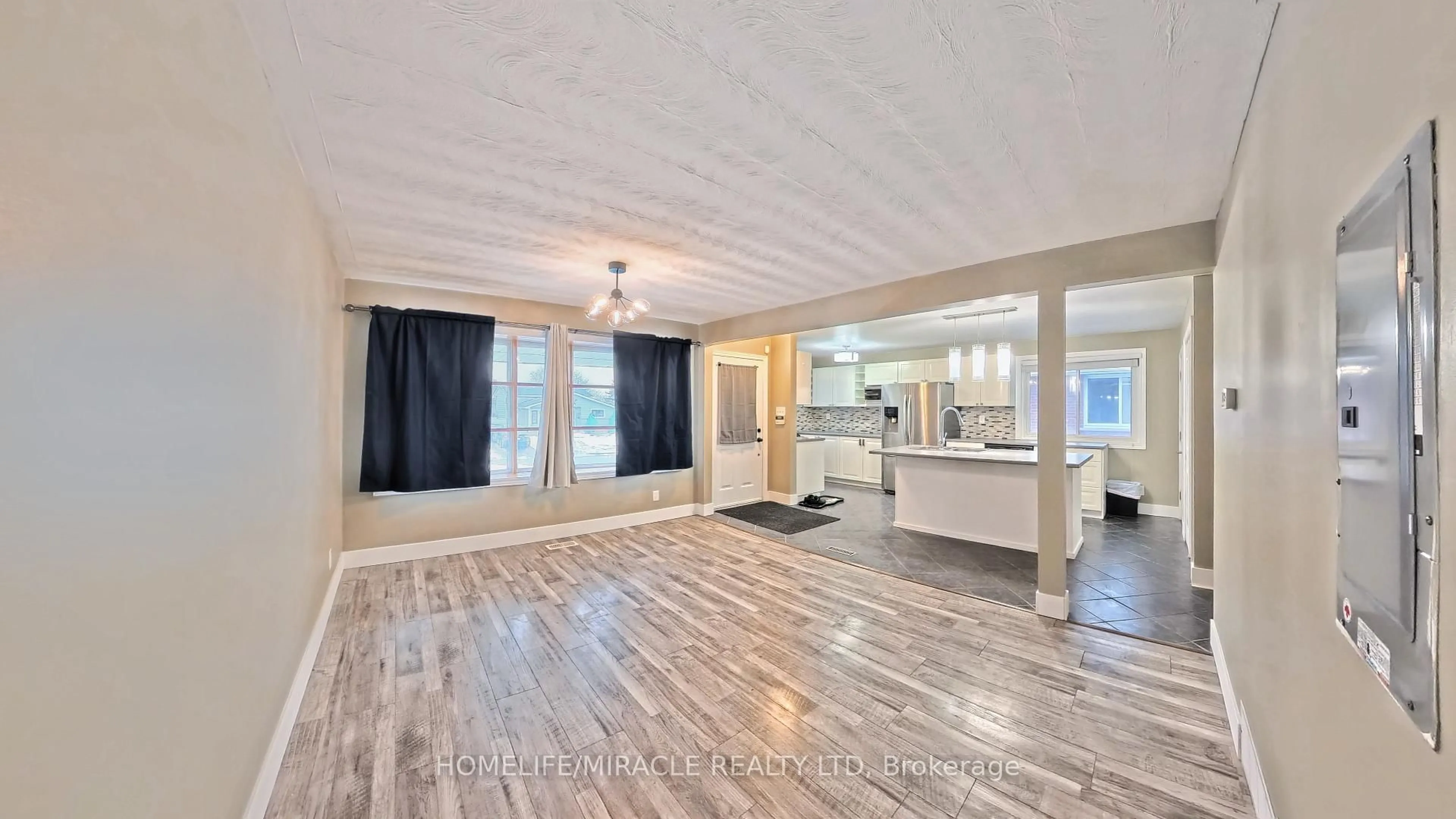 Open concept kitchen, wood/laminate floor for 61 Bosworth Cres, Kitchener Ontario N2E 1Y9