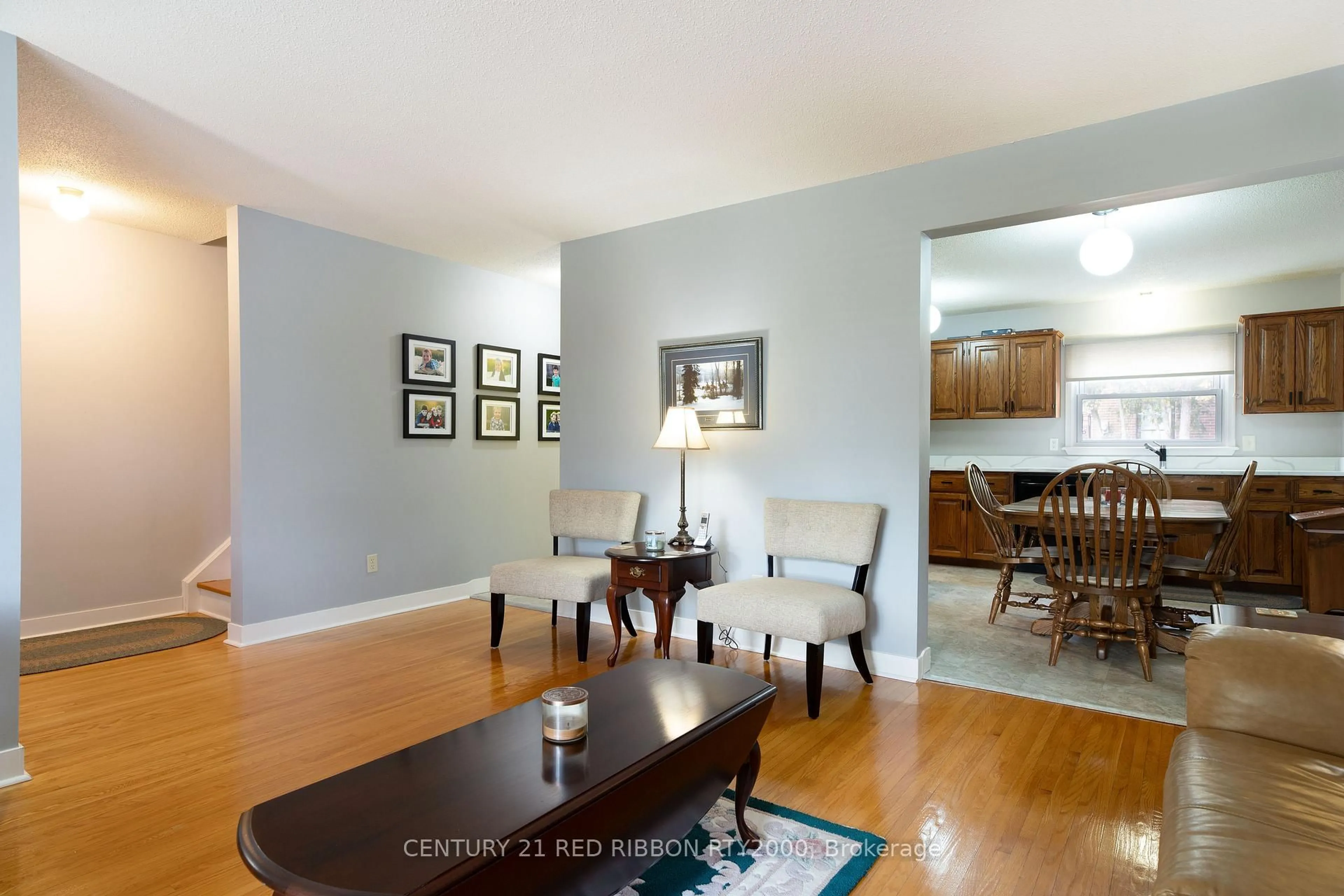 Living room with furniture, wood/laminate floor for 535 Gainsborough Rd #106, London North Ontario N6G 2C5