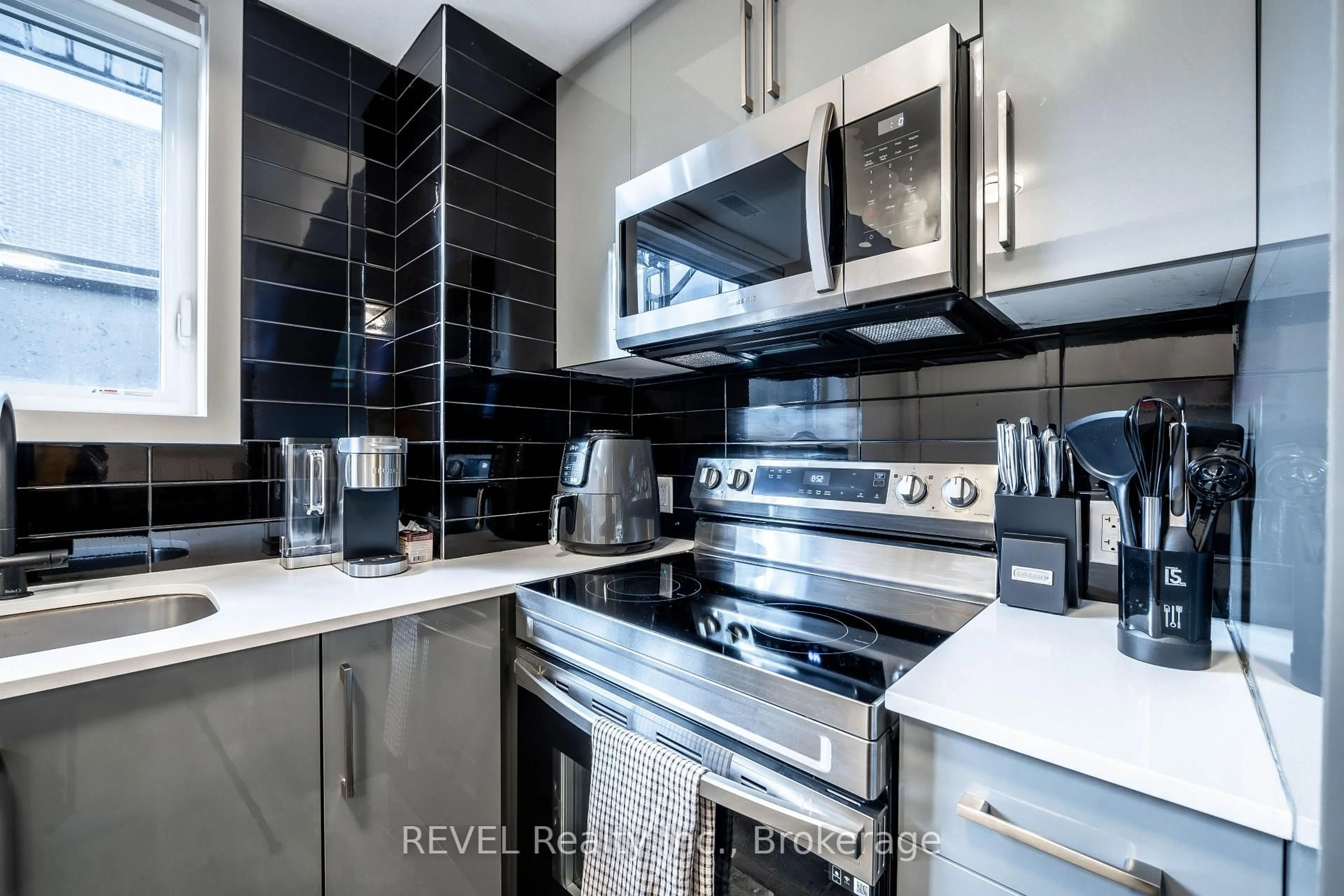 Contemporary kitchen, ceramic/tile floor for 6065 Mcleod Rd #114, Niagara Falls Ontario L2G 0Z7