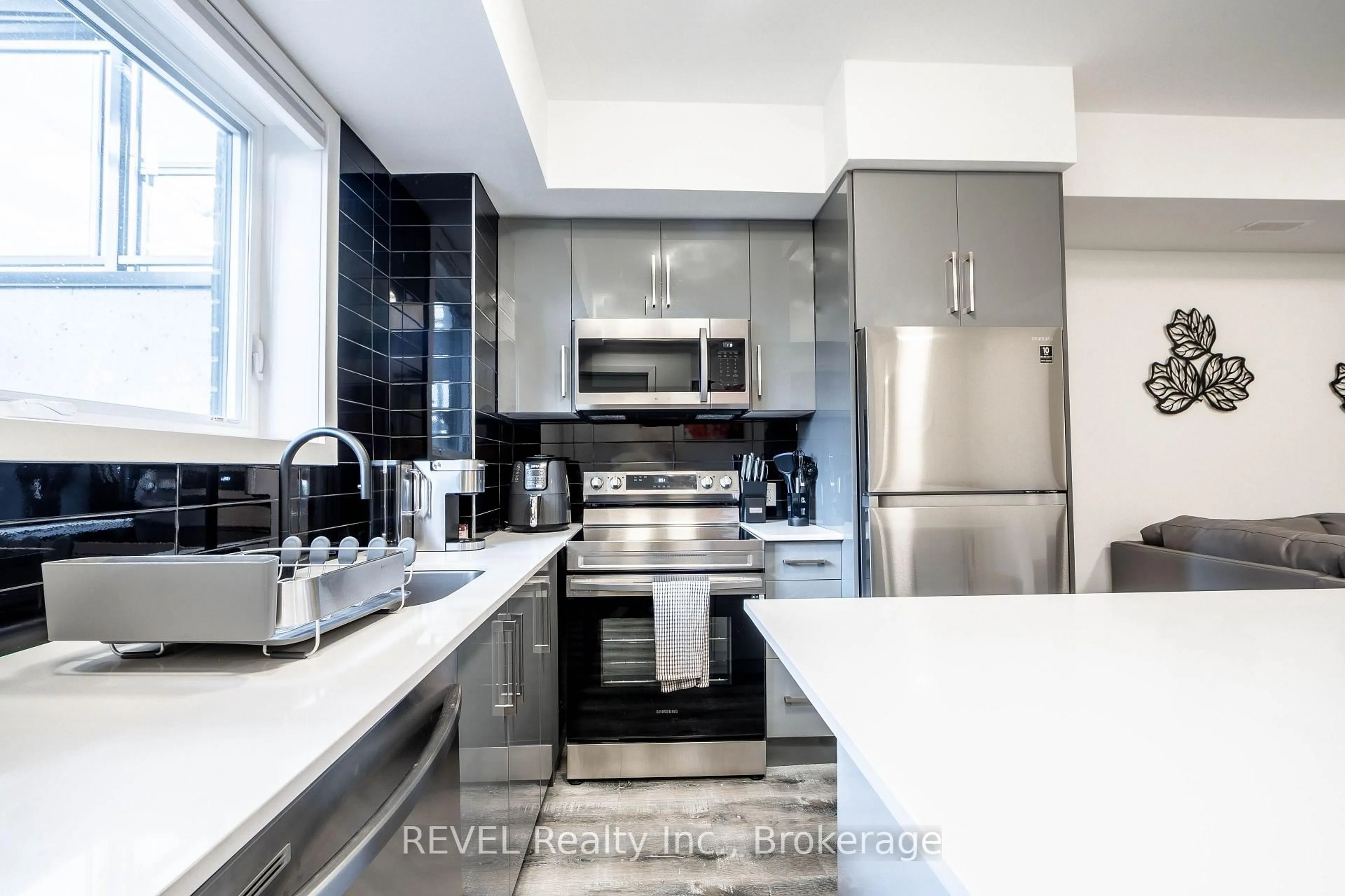 Contemporary kitchen, ceramic/tile floor for 6065 Mcleod Rd #114, Niagara Falls Ontario L2G 0Z7