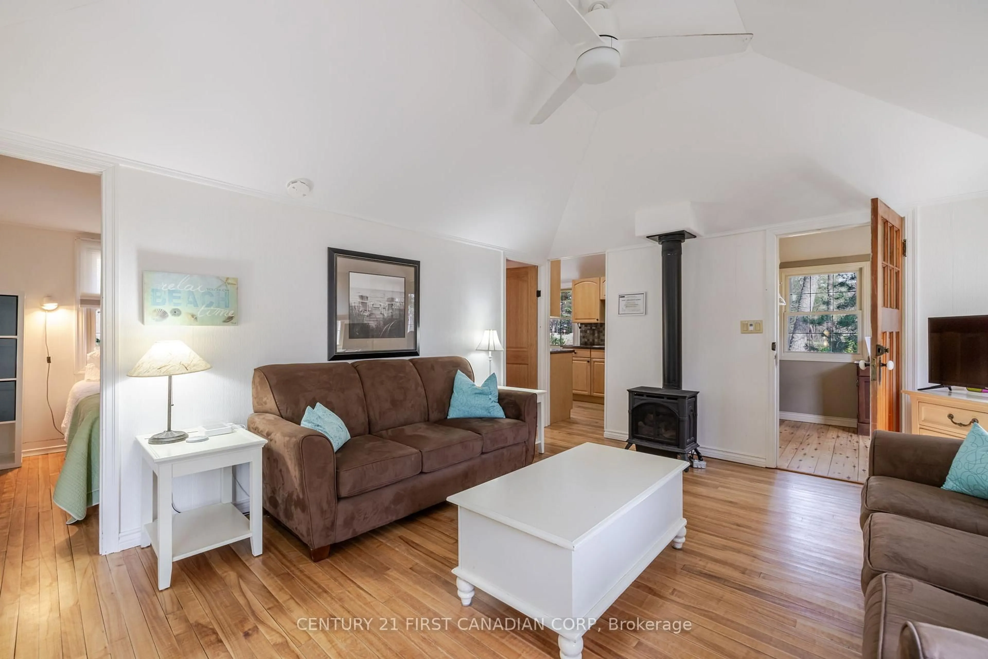 Living room with furniture, wood/laminate floor for 47 Heaman Cres, Lambton Shores Ontario N0M 1T0