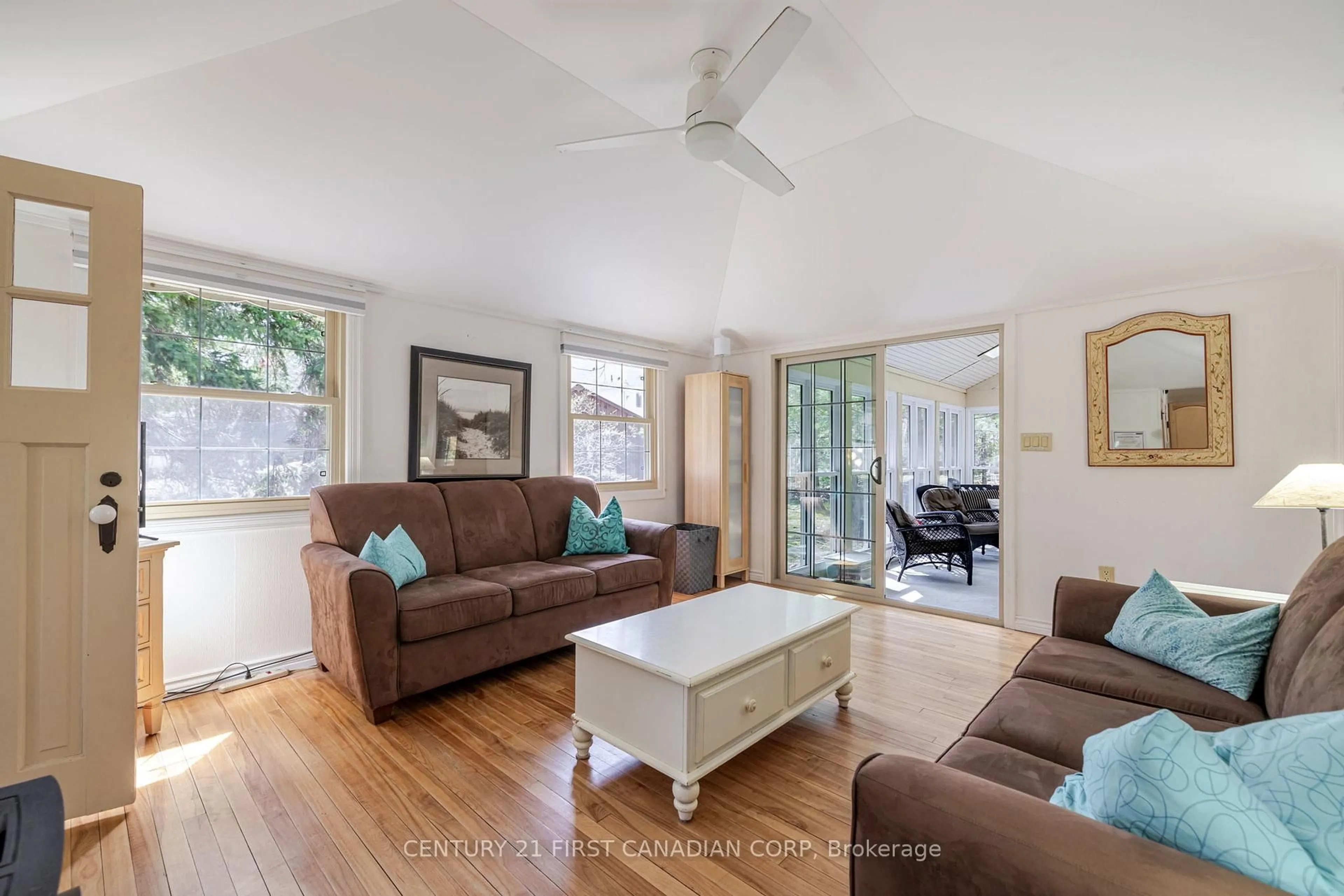 Living room with furniture, wood/laminate floor for 47 Heaman Cres, Lambton Shores Ontario N0M 1T0