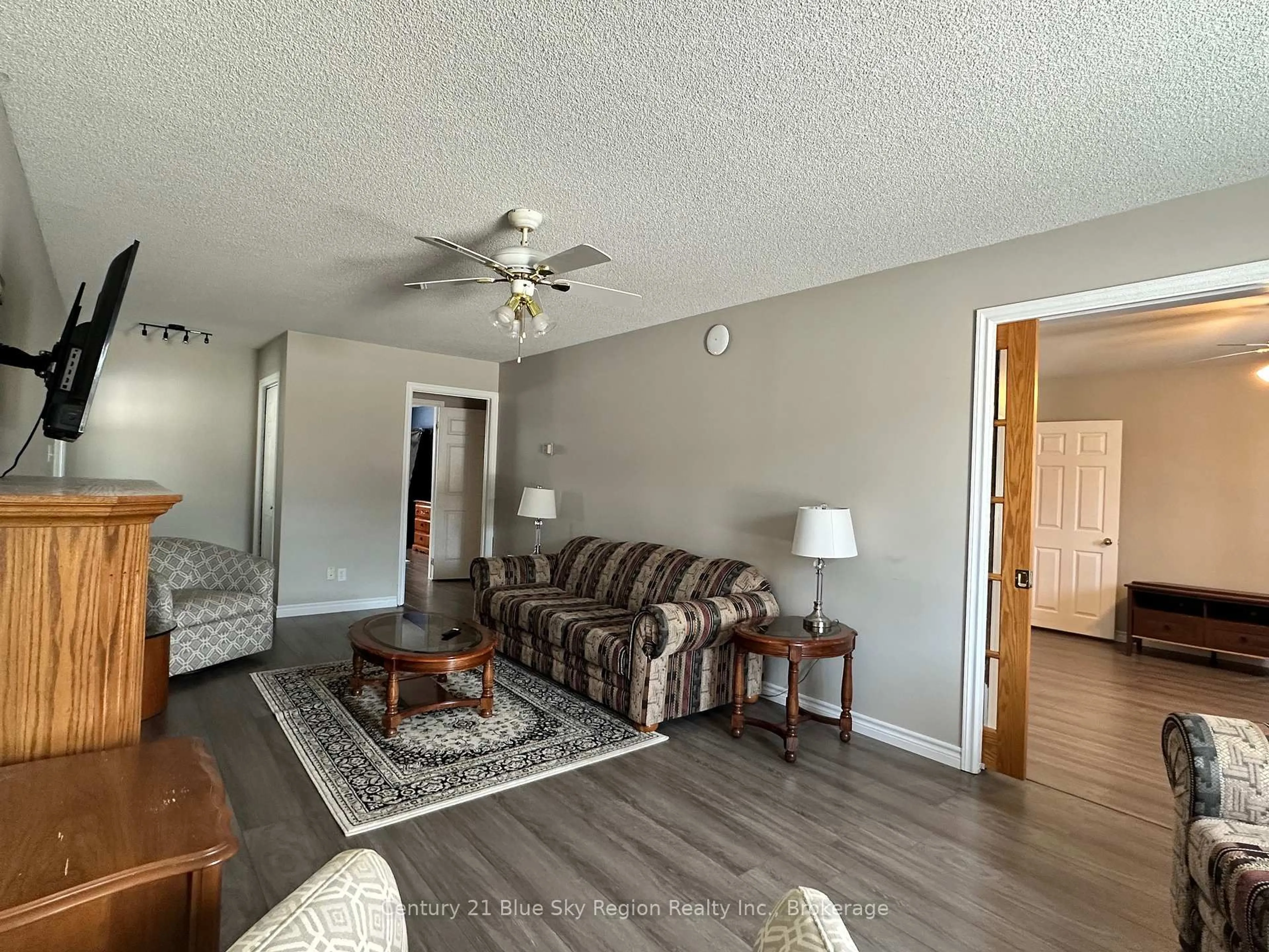 Living room with furniture, wood/laminate floor for 391 Mattawan St, Mattawa Ontario P0H 1V0