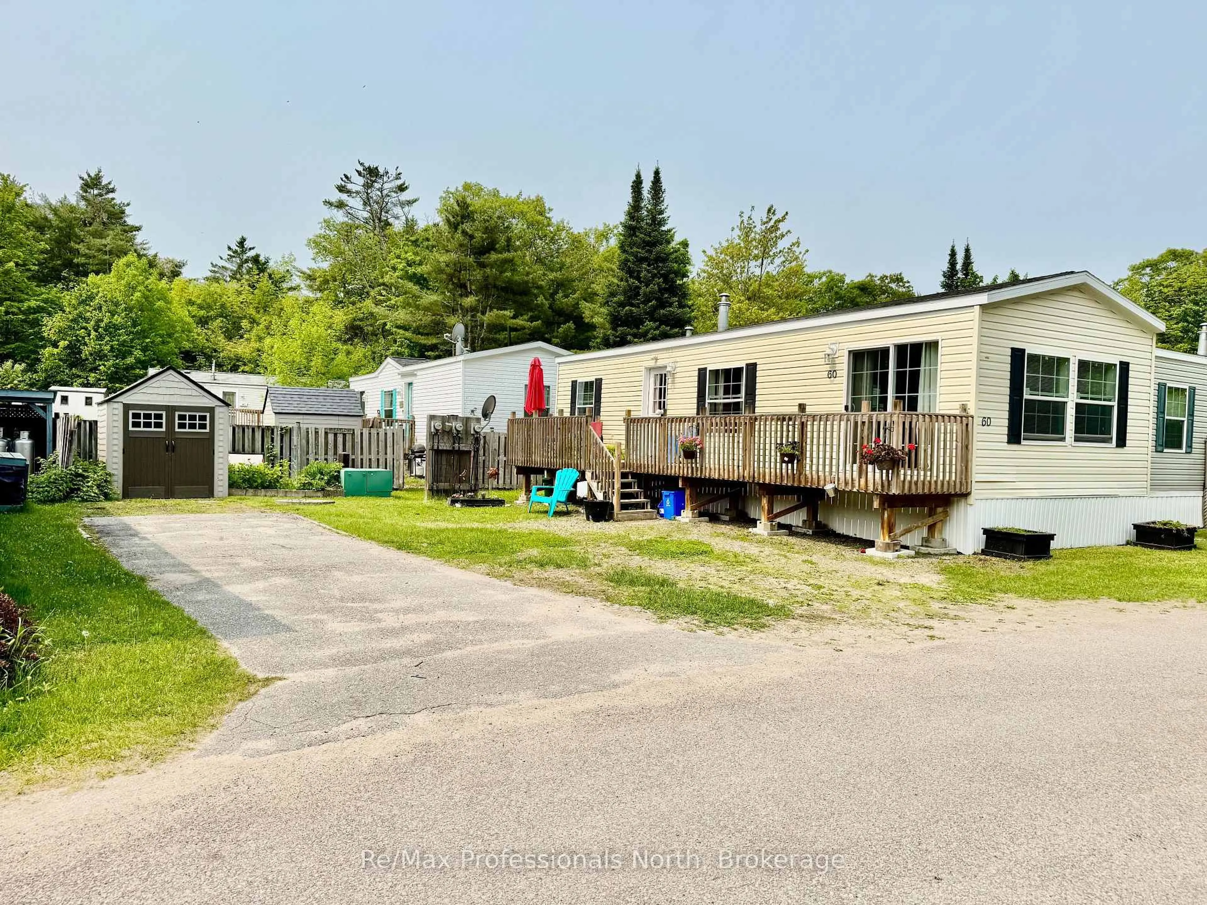 A pic from outside/outdoor area/front of a property/back of a property/a pic from drone, street for 1007 Racoon Rd #60, Gravenhurst Ontario P1P 0C3