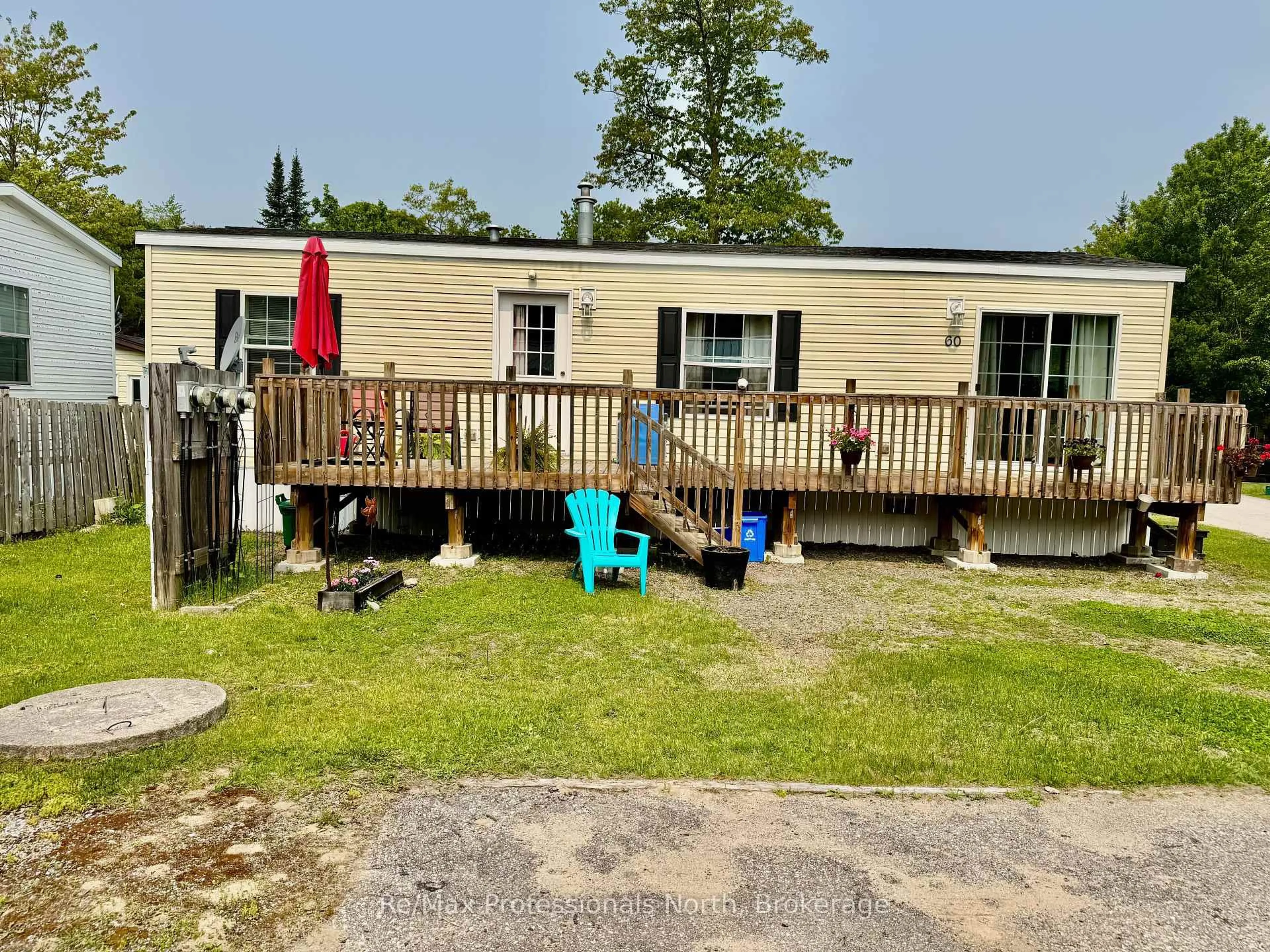 A pic from outside/outdoor area/front of a property/back of a property/a pic from drone, water/lake/river/ocean view for 1007 Racoon Rd #60, Gravenhurst Ontario P1P 0C3