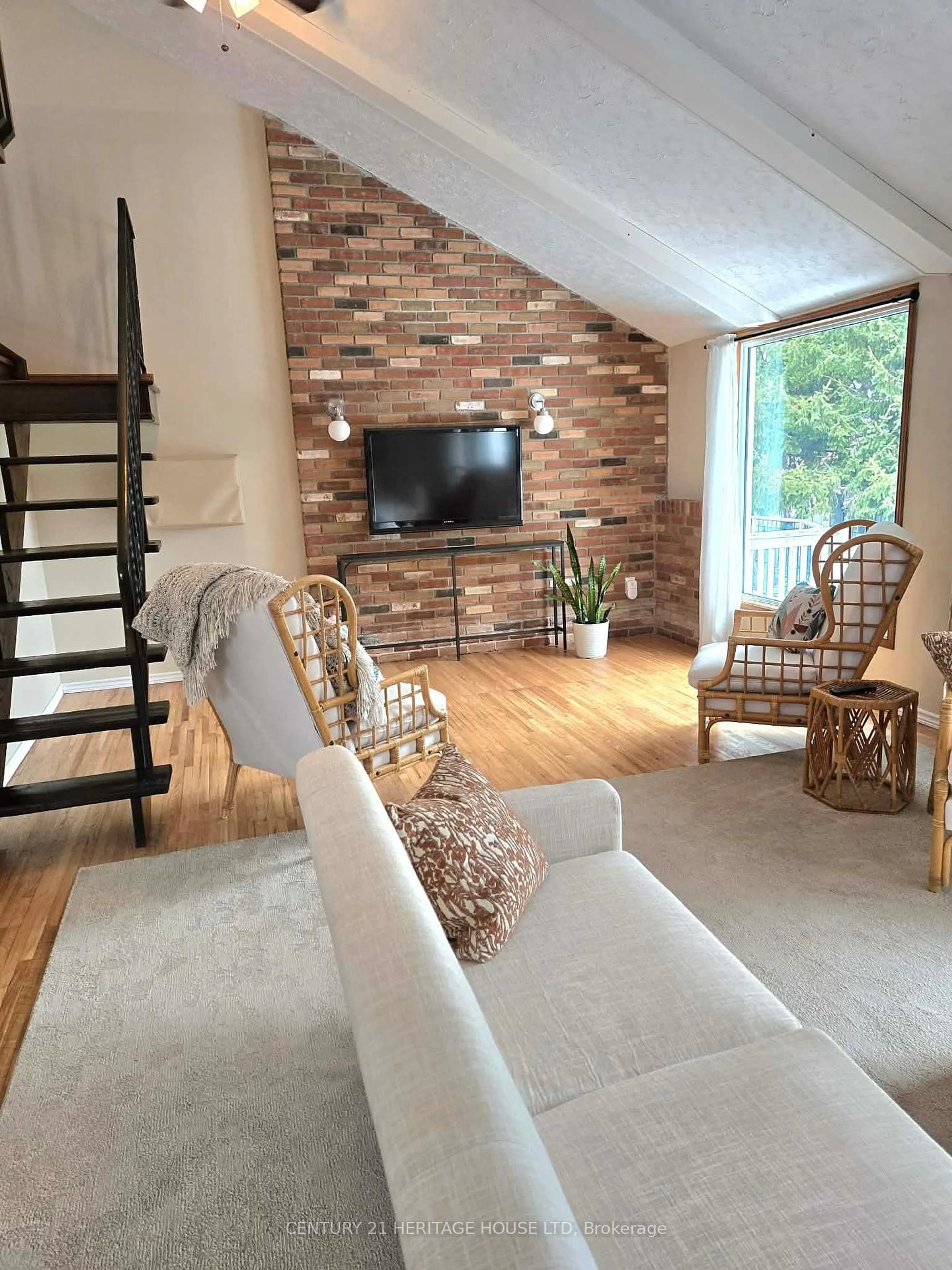 Living room with furniture, wood/laminate floor for 48 Luton Cres, St. Thomas Ontario N5R 5R7