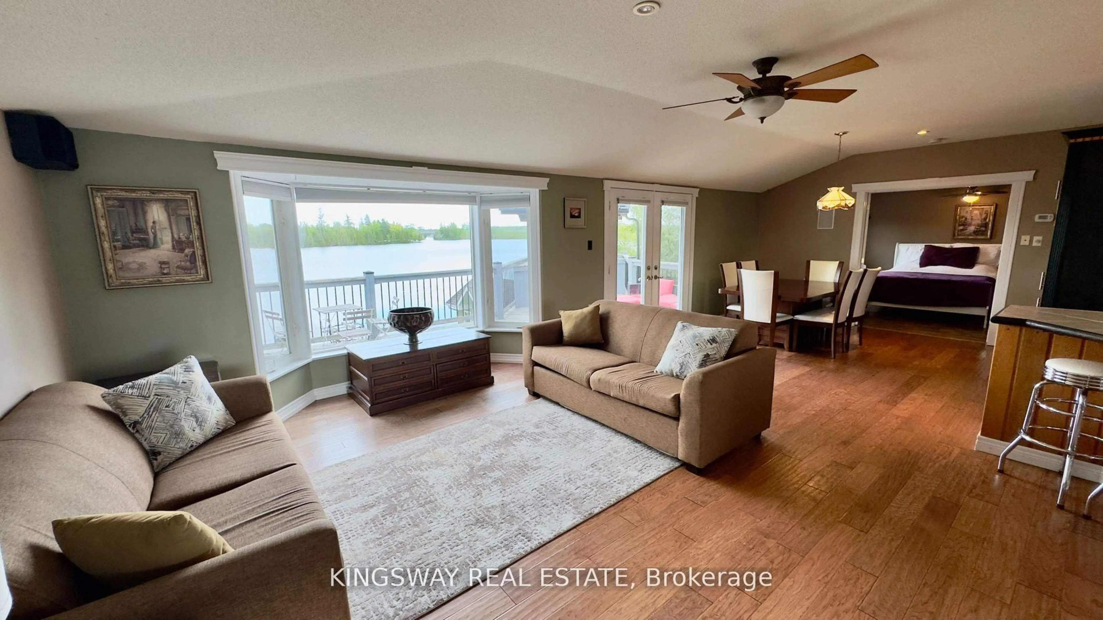 Living room with furniture, wood/laminate floor for 18 Mitchellview Rd, Kawartha Lakes Ontario K0M 2B0