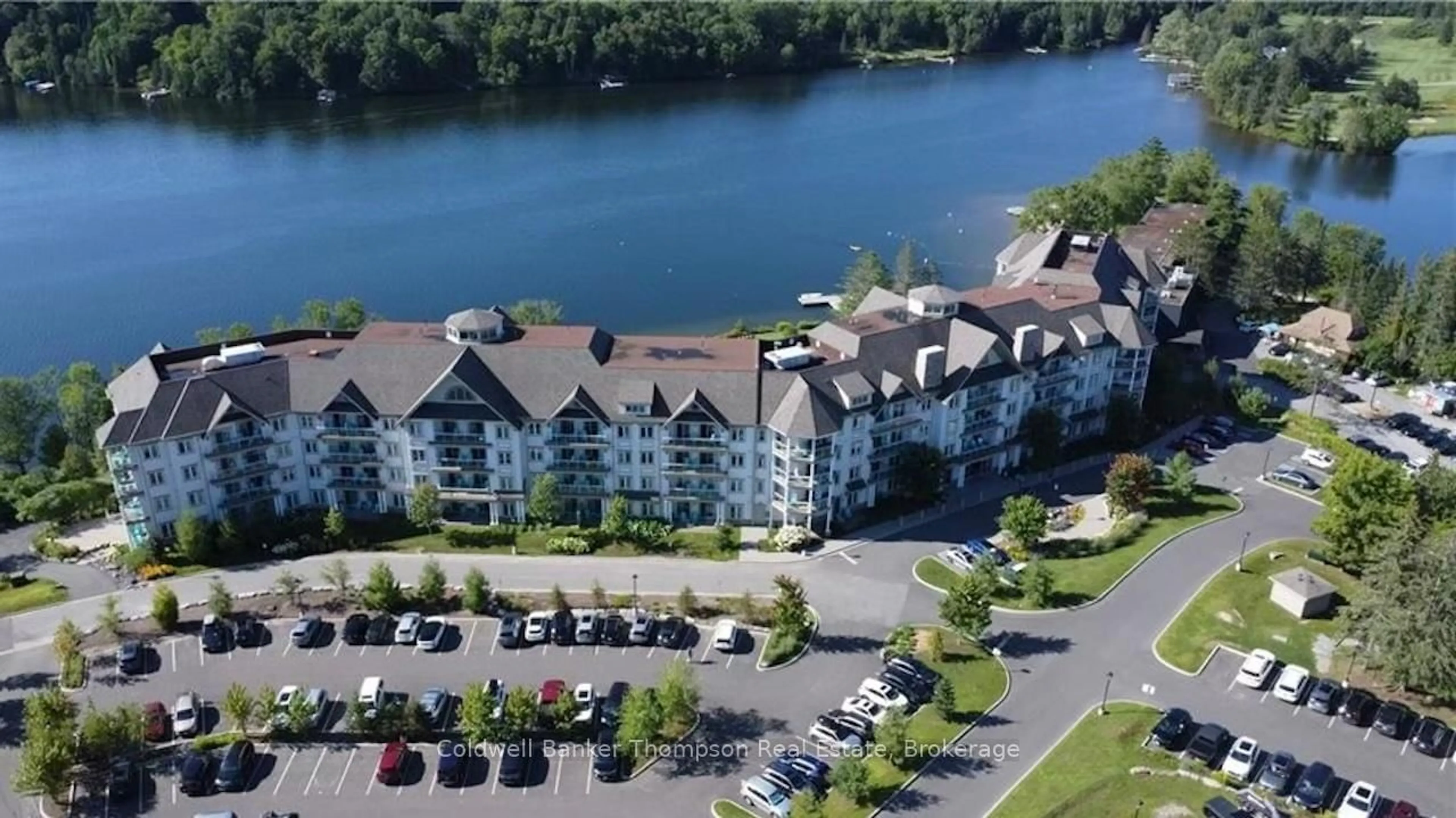 A pic from outside/outdoor area/front of a property/back of a property/a pic from drone, water/lake/river/ocean view for 25 PEN LAKE POINT Rd #110, Huntsville Ontario P1H 1A9