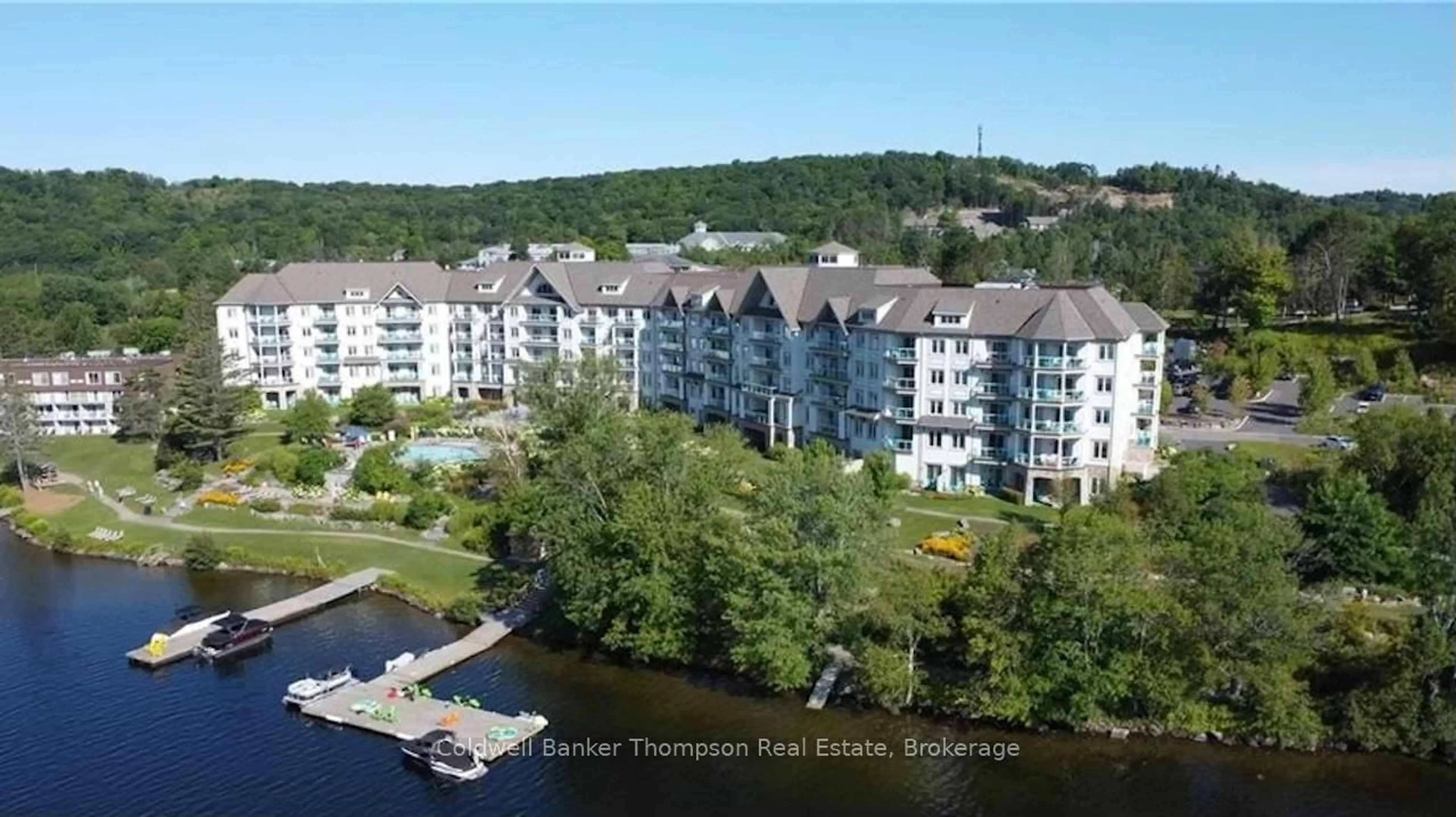 A pic from outside/outdoor area/front of a property/back of a property/a pic from drone, water/lake/river/ocean view for 25 PEN LAKE POINT Rd #110, Huntsville Ontario P1H 1A9