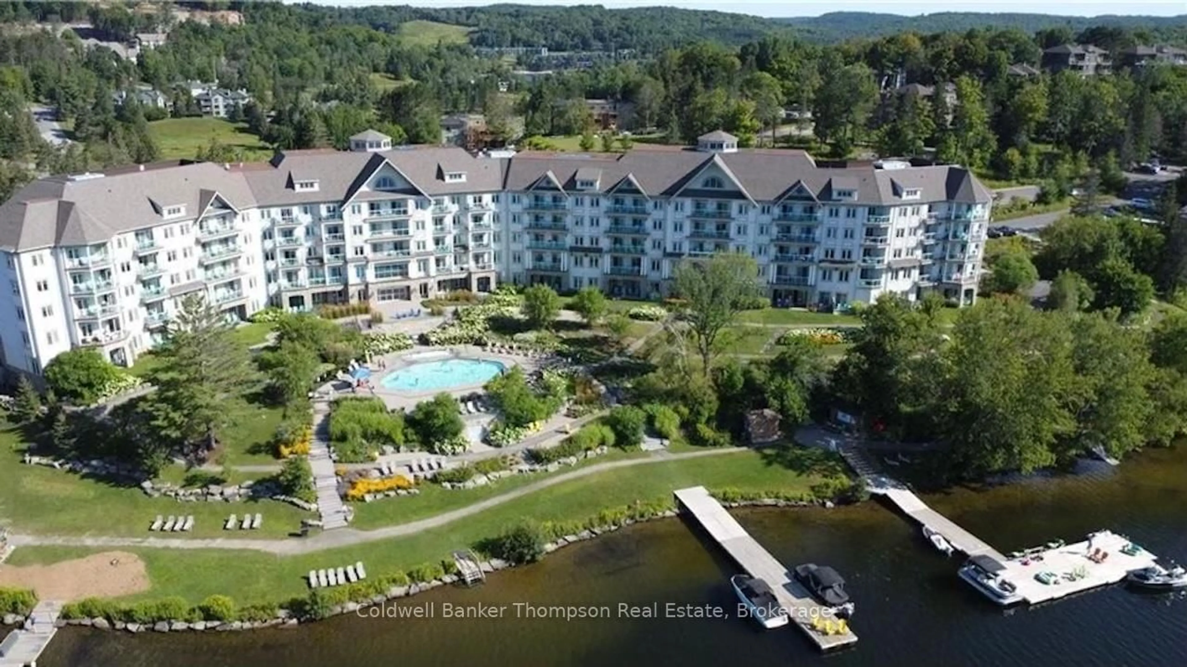 A pic from outside/outdoor area/front of a property/back of a property/a pic from drone, water/lake/river/ocean view for 25 PEN LAKE POINT Rd #110, Huntsville Ontario P1H 1A9