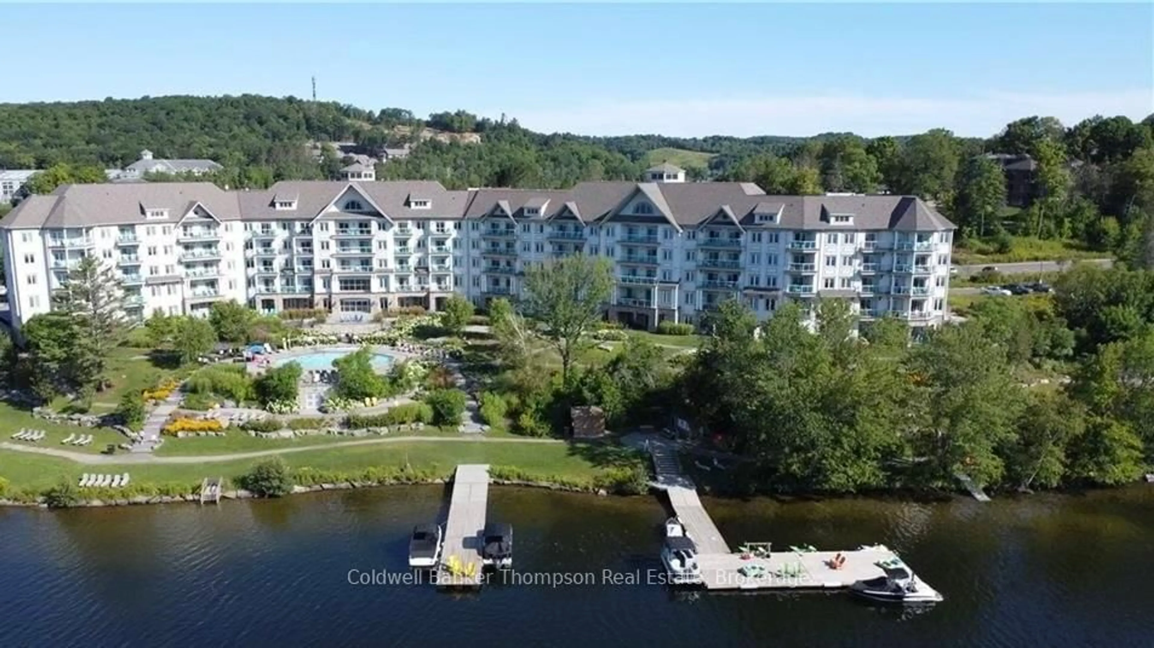 A pic from outside/outdoor area/front of a property/back of a property/a pic from drone, water/lake/river/ocean view for 25 PEN LAKE POINT Rd #110, Huntsville Ontario P1H 1A9