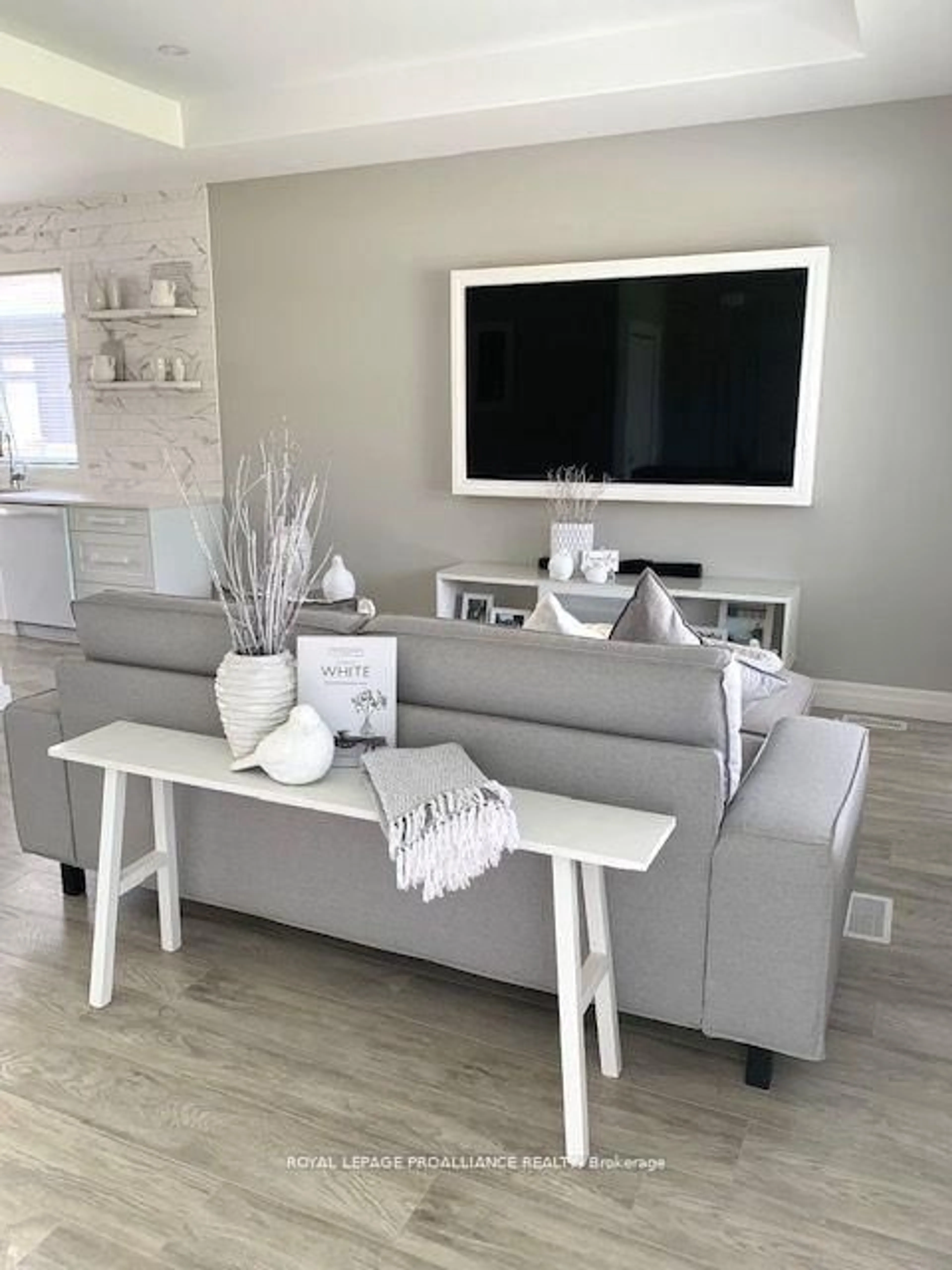 Living room with furniture, wood/laminate floor for 14 Clayton John Ave, Brighton Ontario K0K 1H0