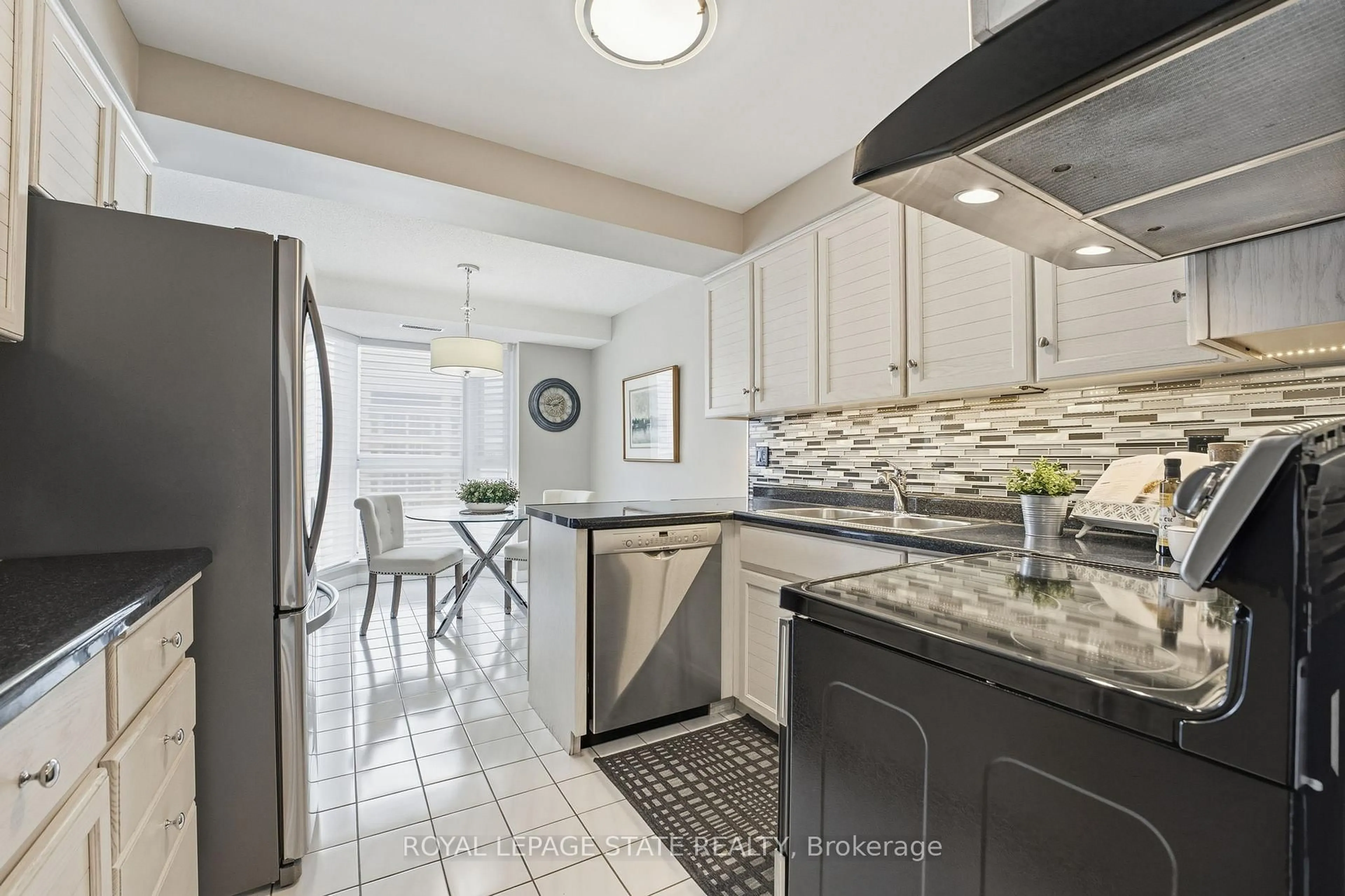 Open concept kitchen, ceramic/tile floor for 67 Caroline St #5E, Hamilton Ontario L8P 3K6
