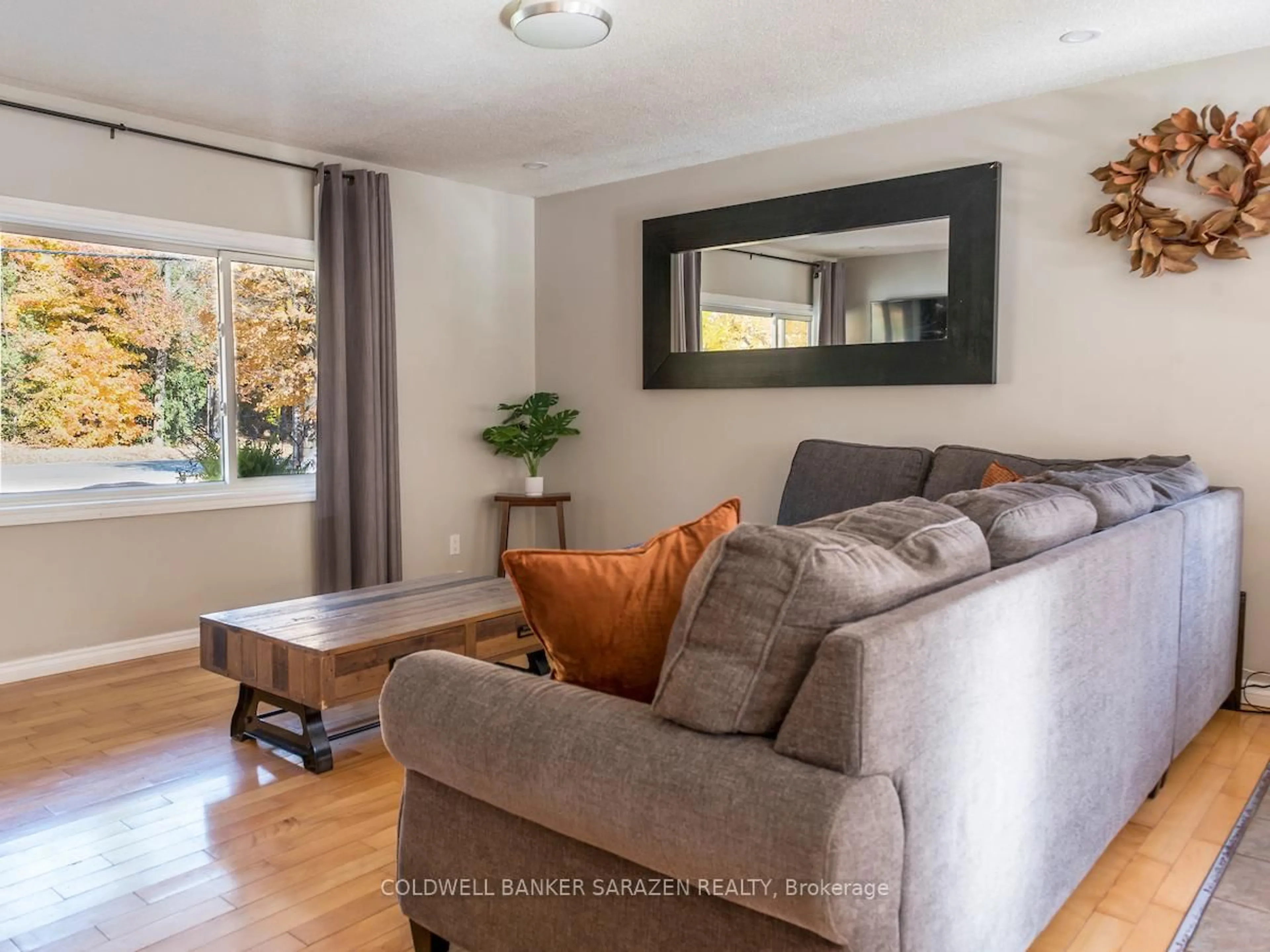 Living room with furniture, wood/laminate floor for 875 Usborne St, Braeside Ontario K0A 1G0