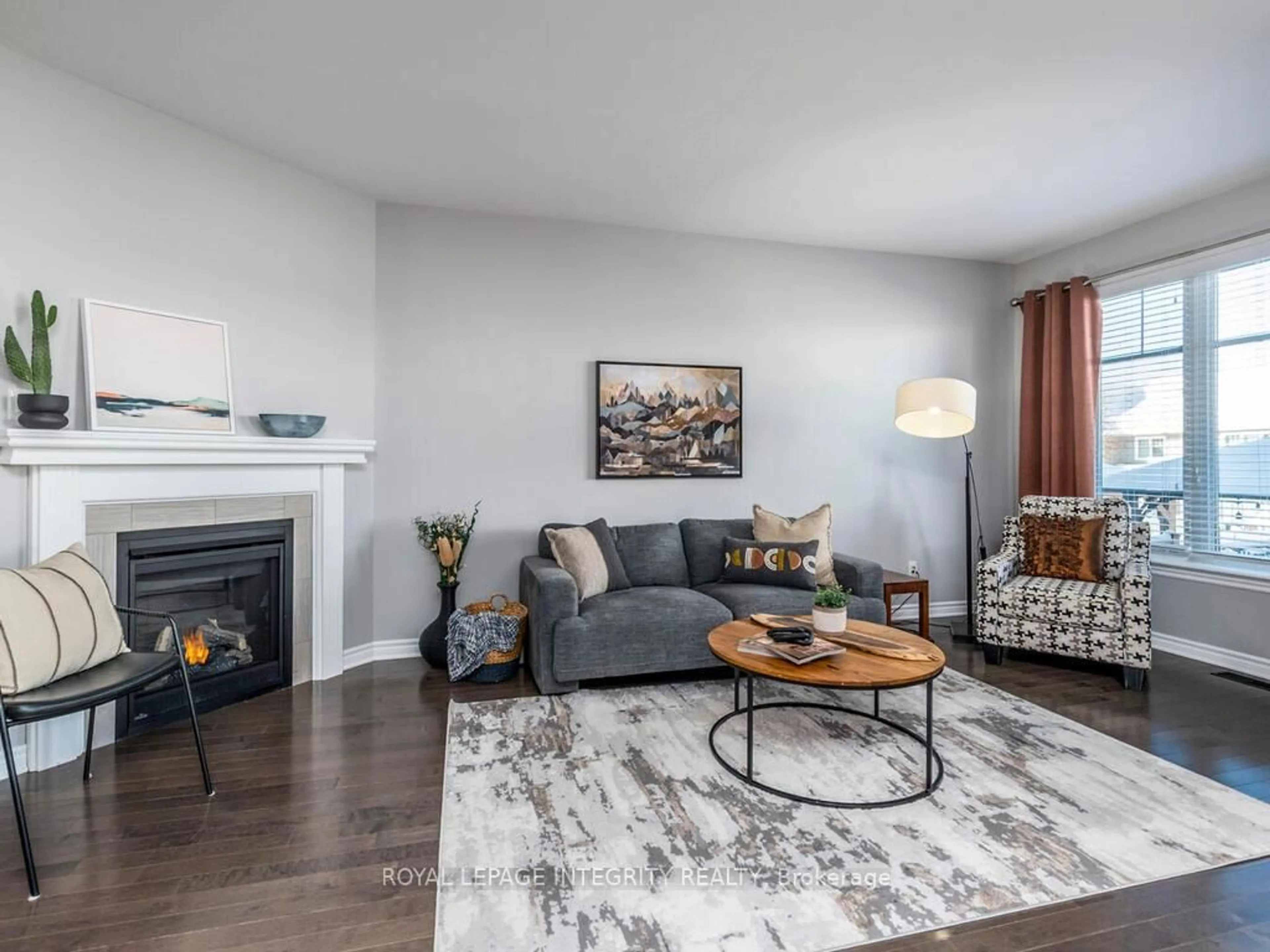 Living room with furniture, wood/laminate floor for 634 Cartographe St, Ottawa Ontario K4A 3N6