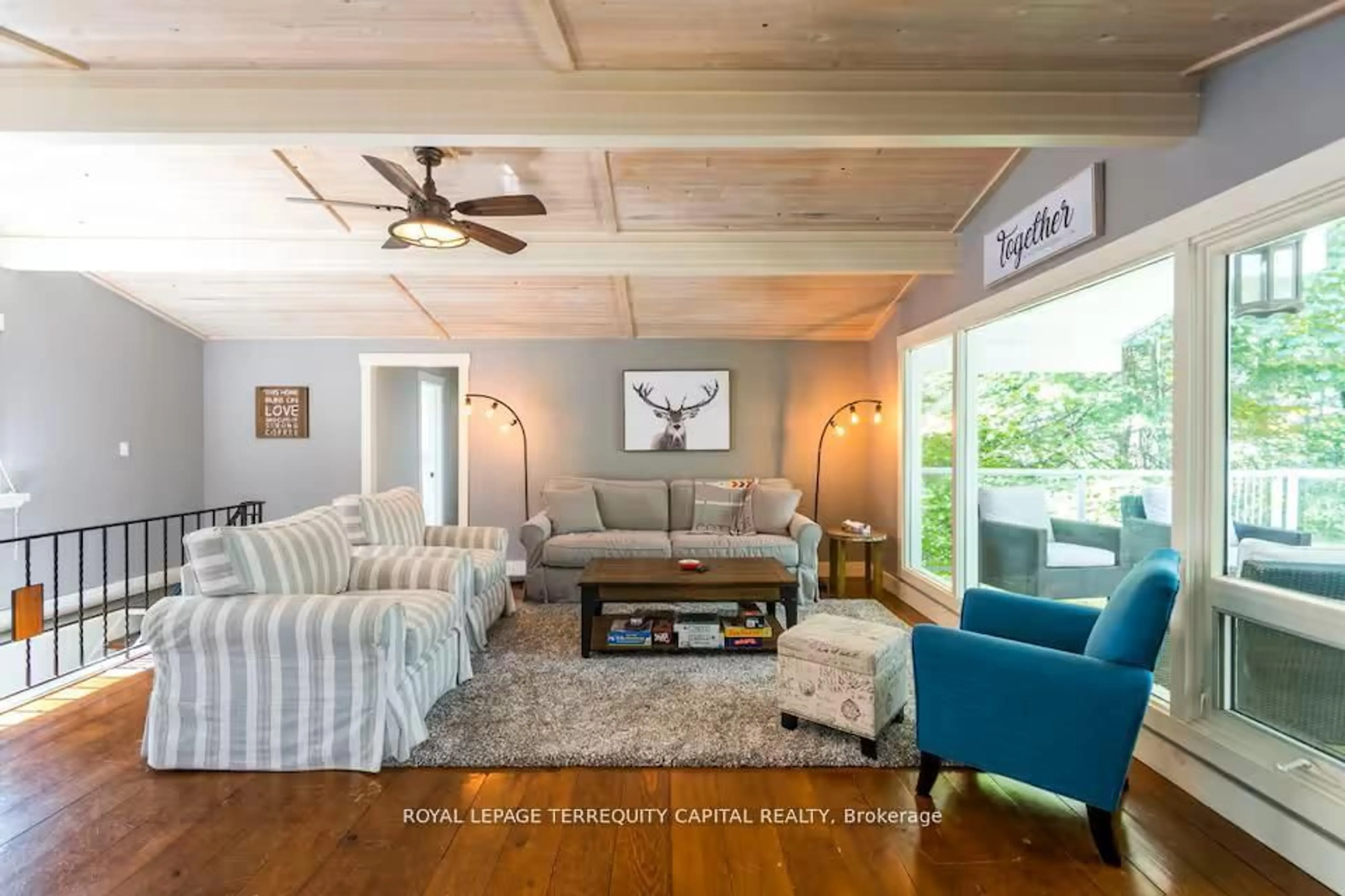 Living room with furniture, wood/laminate floor for 9 Denniss Dr, Bracebridge Ontario P1L 1W9