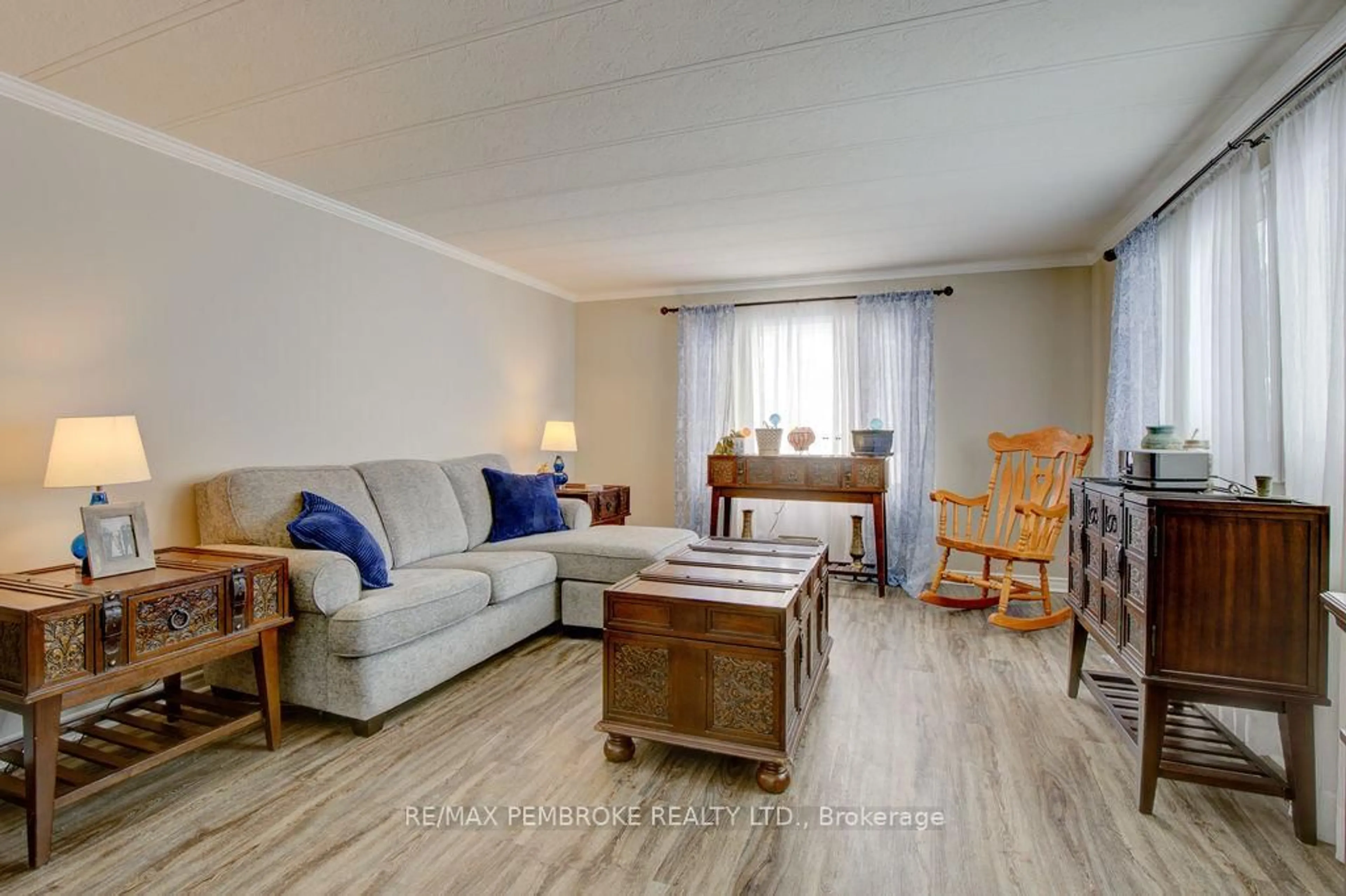 Living room with furniture, wood/laminate floor for 66 Pinehurst Estates, Petawawa Ontario K8H 2H2