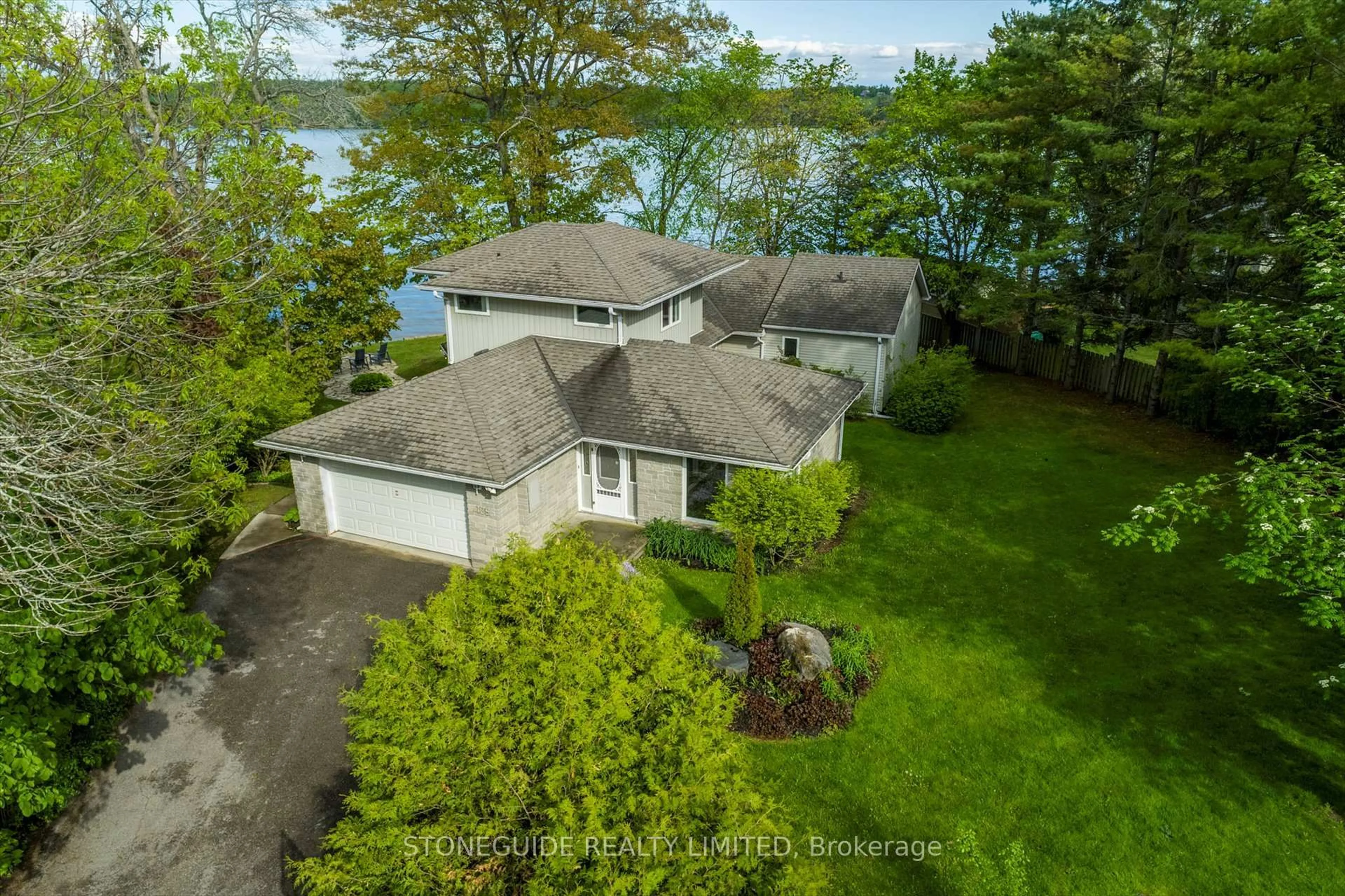 A pic from outside/outdoor area/front of a property/back of a property/a pic from drone, water/lake/river/ocean view for 409 Gifford Dr, Selwyn Ontario K9J 6X2