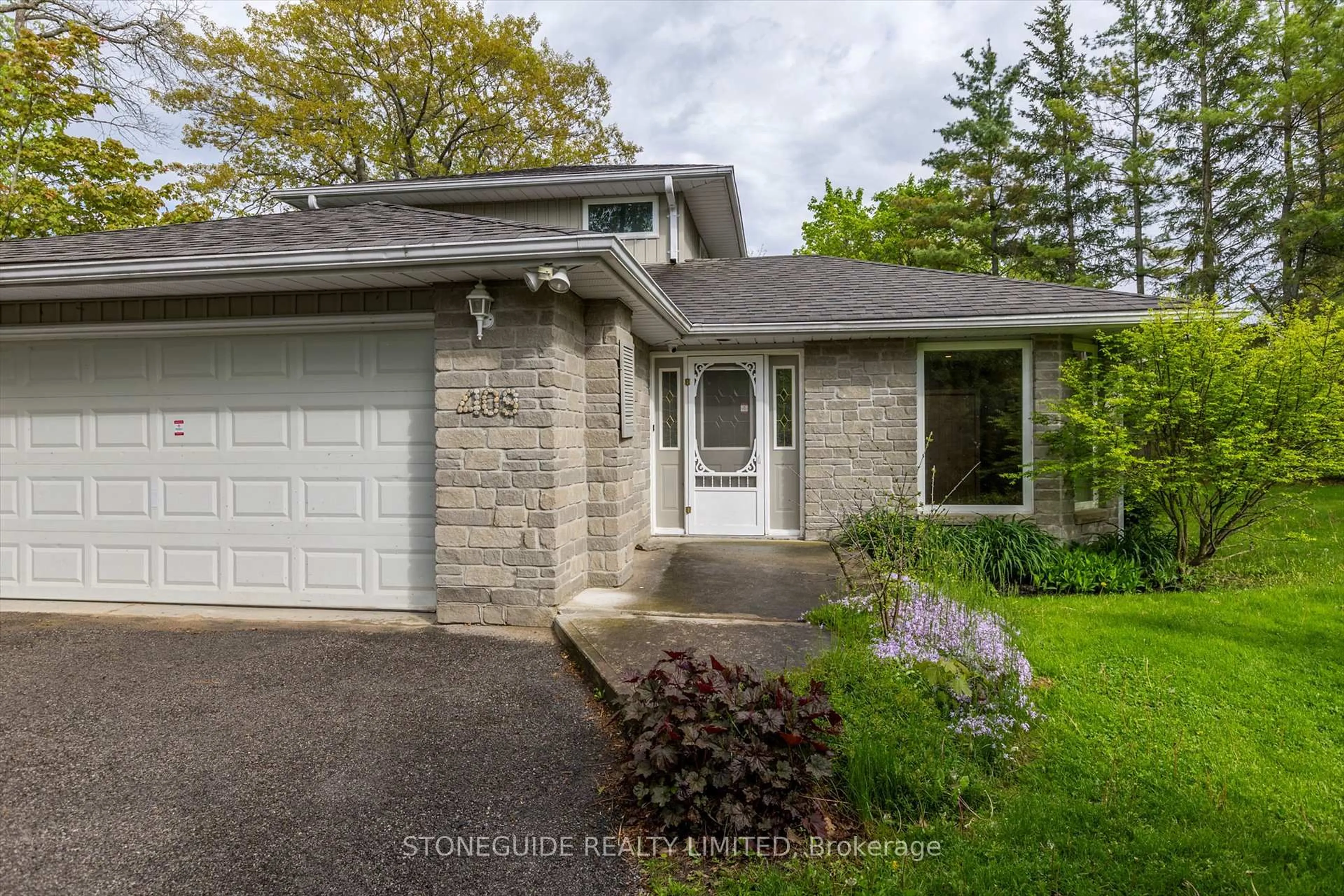 Home with brick exterior material, street for 409 Gifford Dr, Selwyn Ontario K9J 6X2