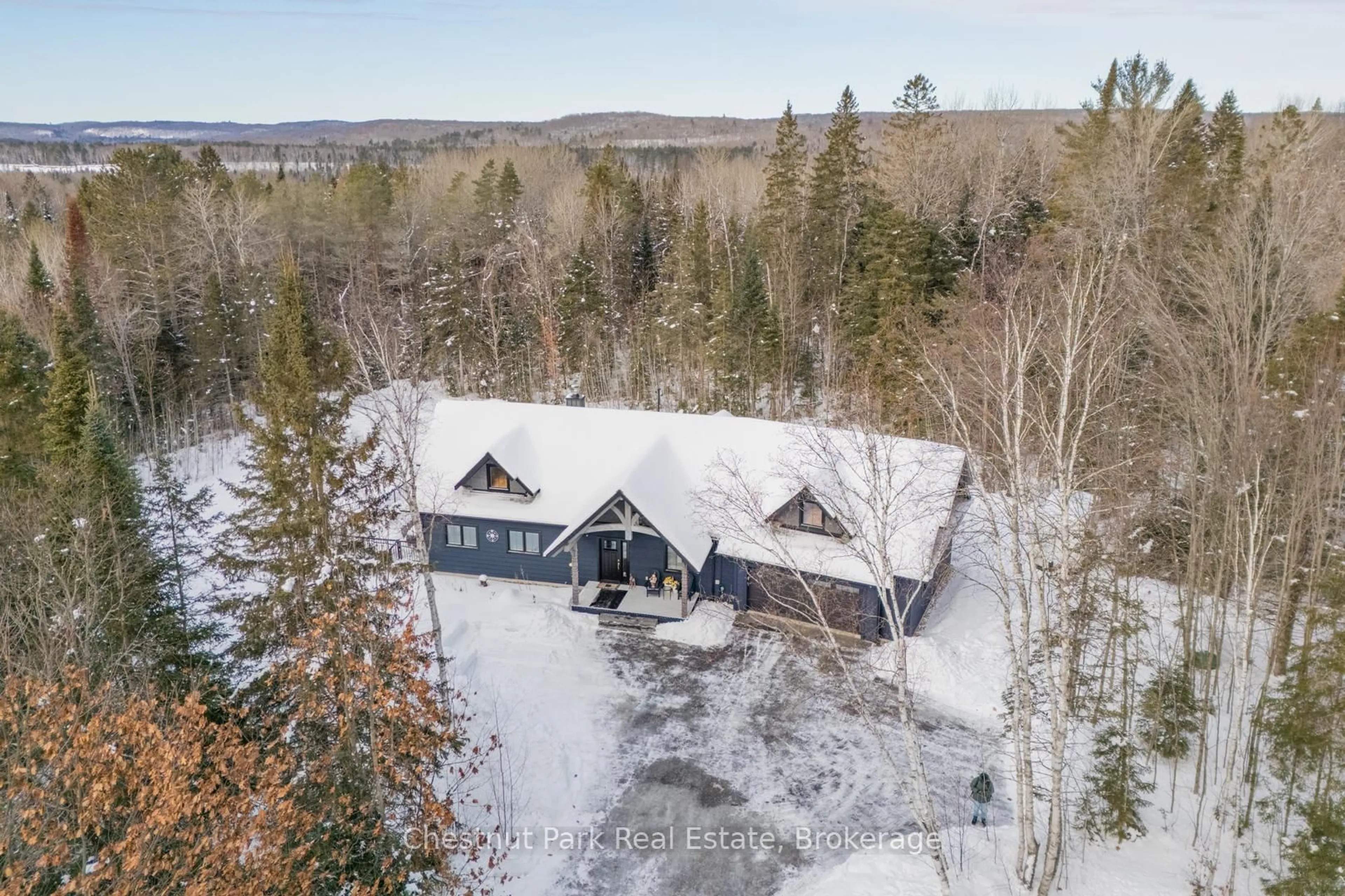 A pic from outside/outdoor area/front of a property/back of a property/a pic from drone, mountain view for 86 BOWYER Rd, Huntsville Ontario P1H 2J4