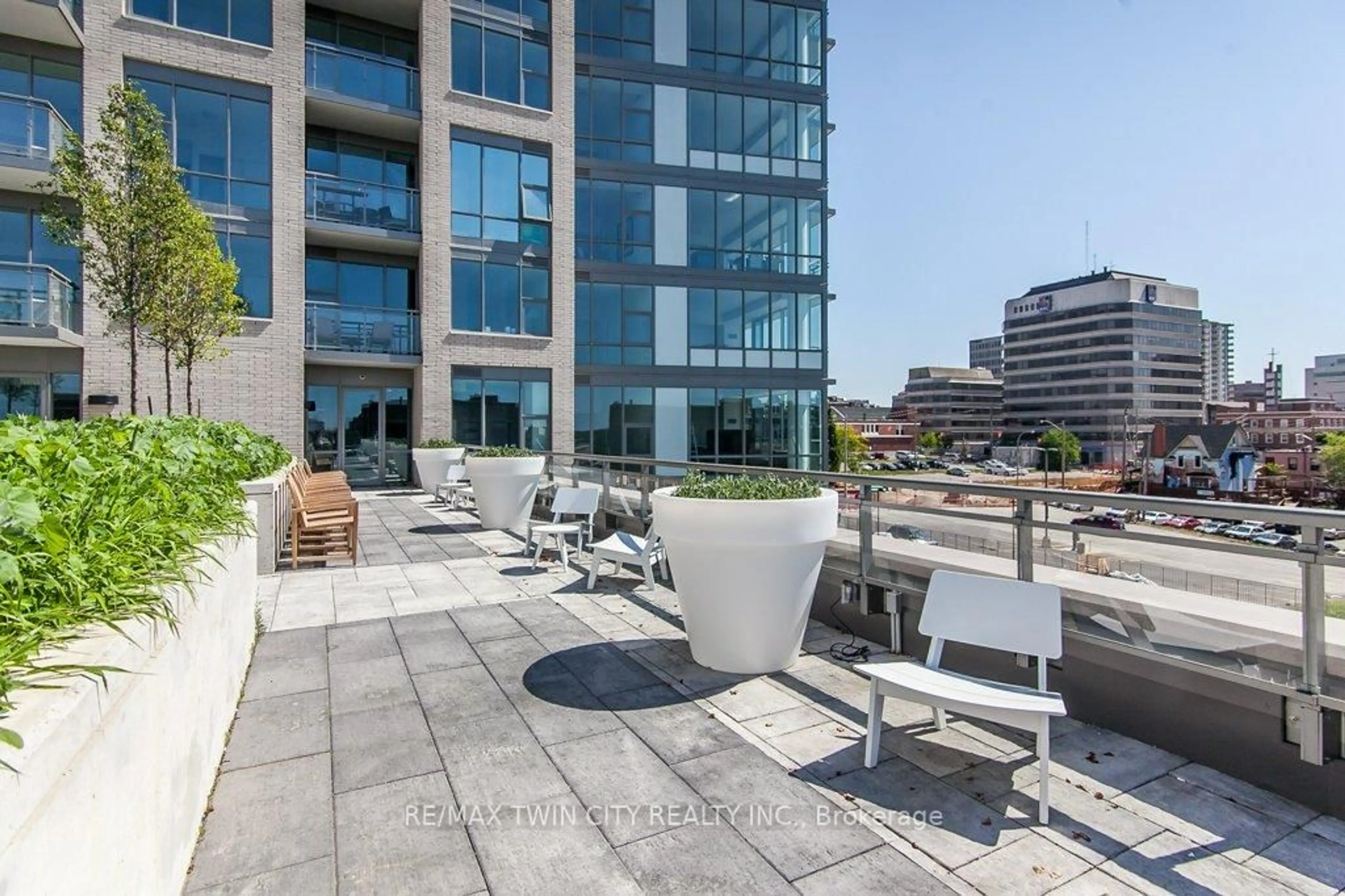 Patio, city buildings view from balcony for 85 DUKE St #402, Kitchener Ontario N2G 1A6