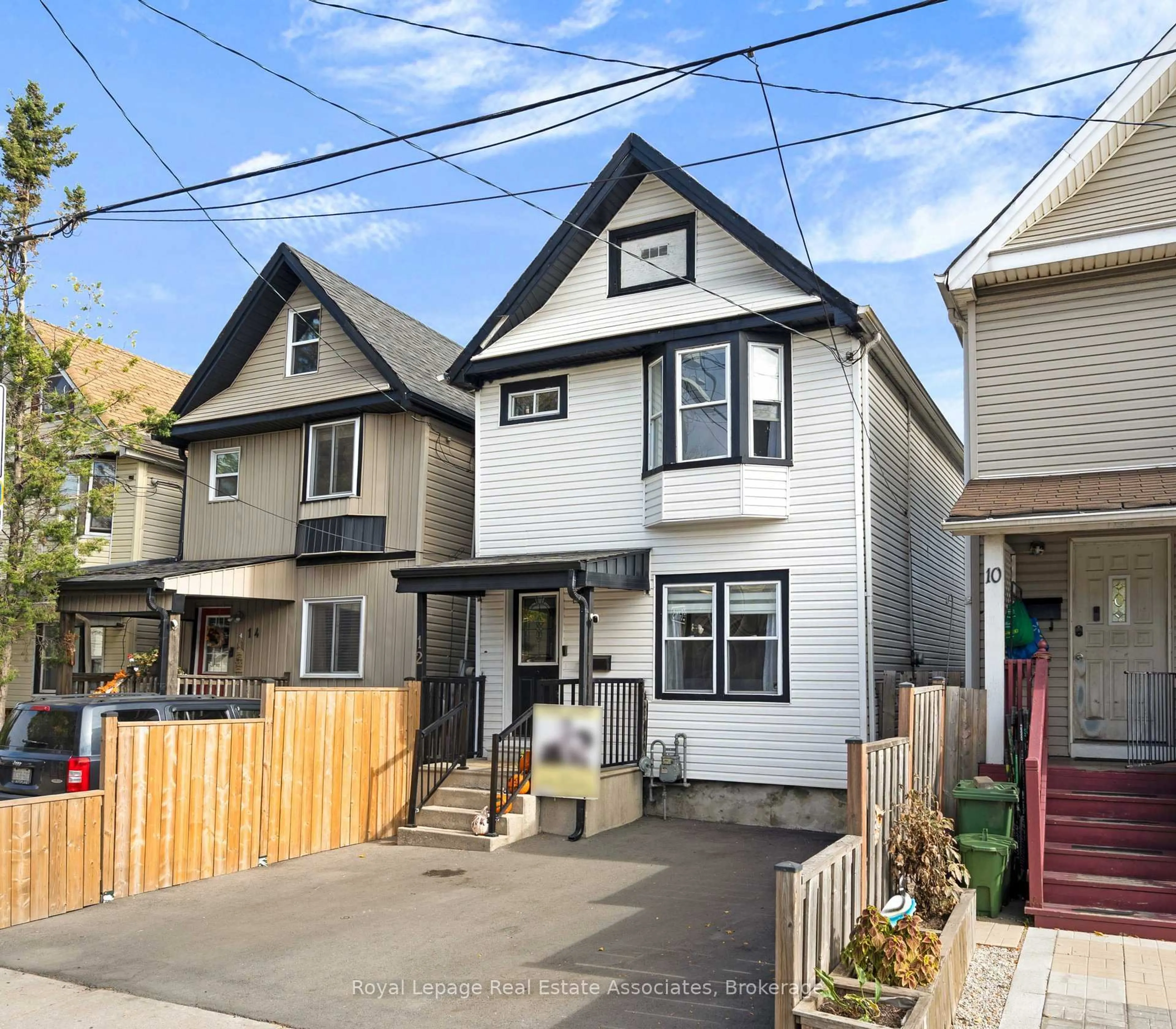 Home with vinyl exterior material, street for 12 Lincoln St, Hamilton Ontario L8L 7L5