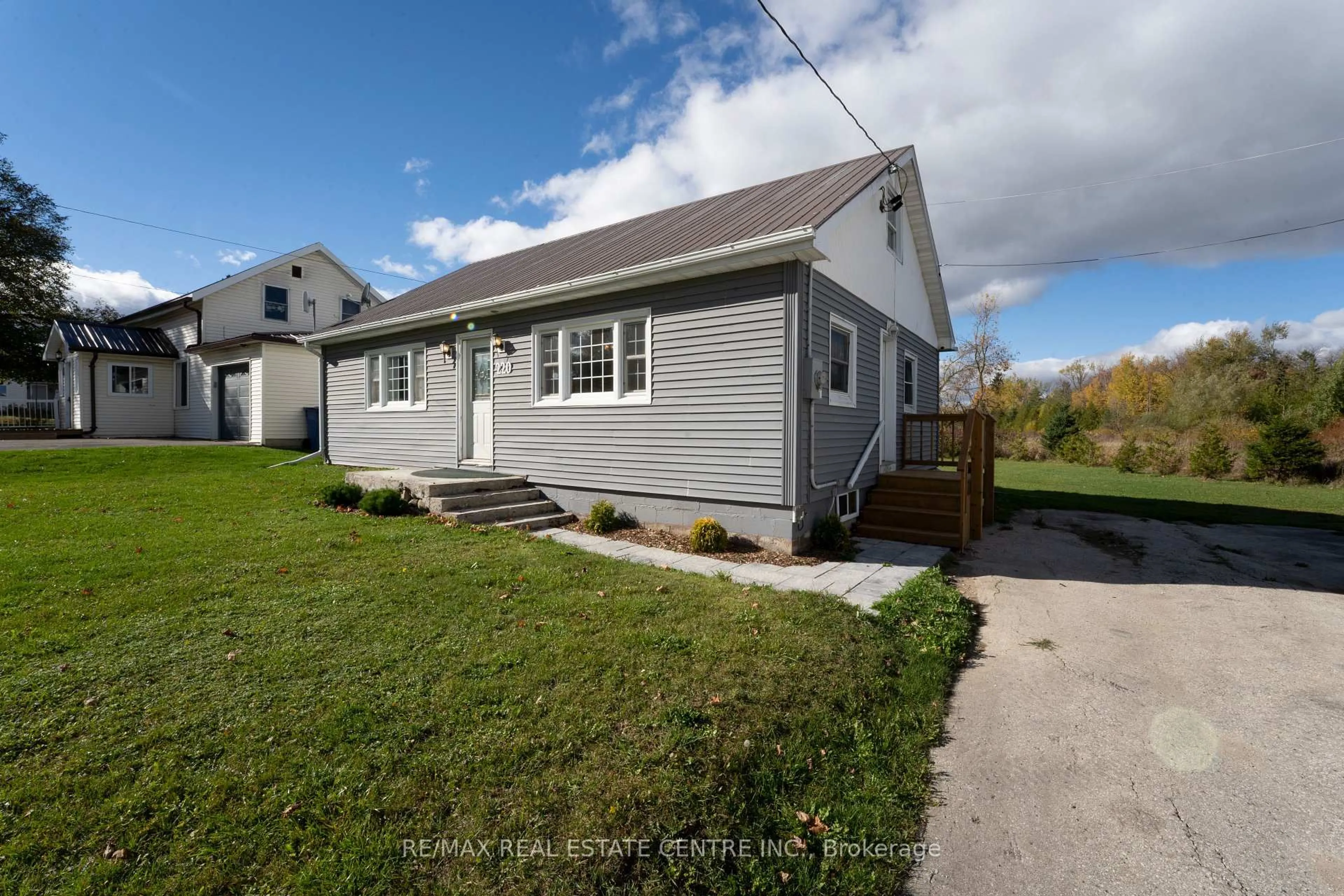 Home with vinyl exterior material, street for 220 Owen Sound St, Southgate Ontario N0C 1C0