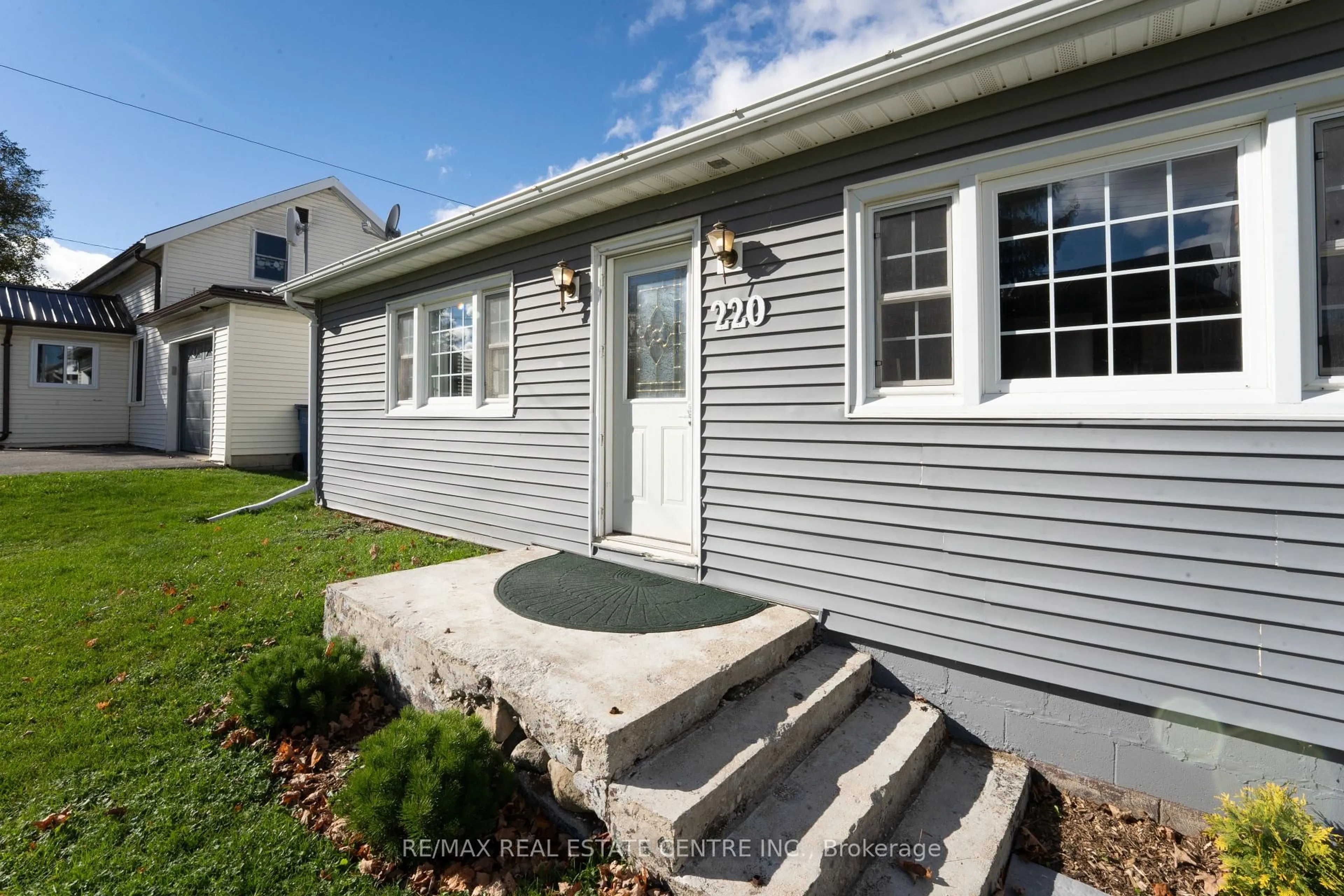 Home with vinyl exterior material, street for 220 Owen Sound St, Southgate Ontario N0C 1C0