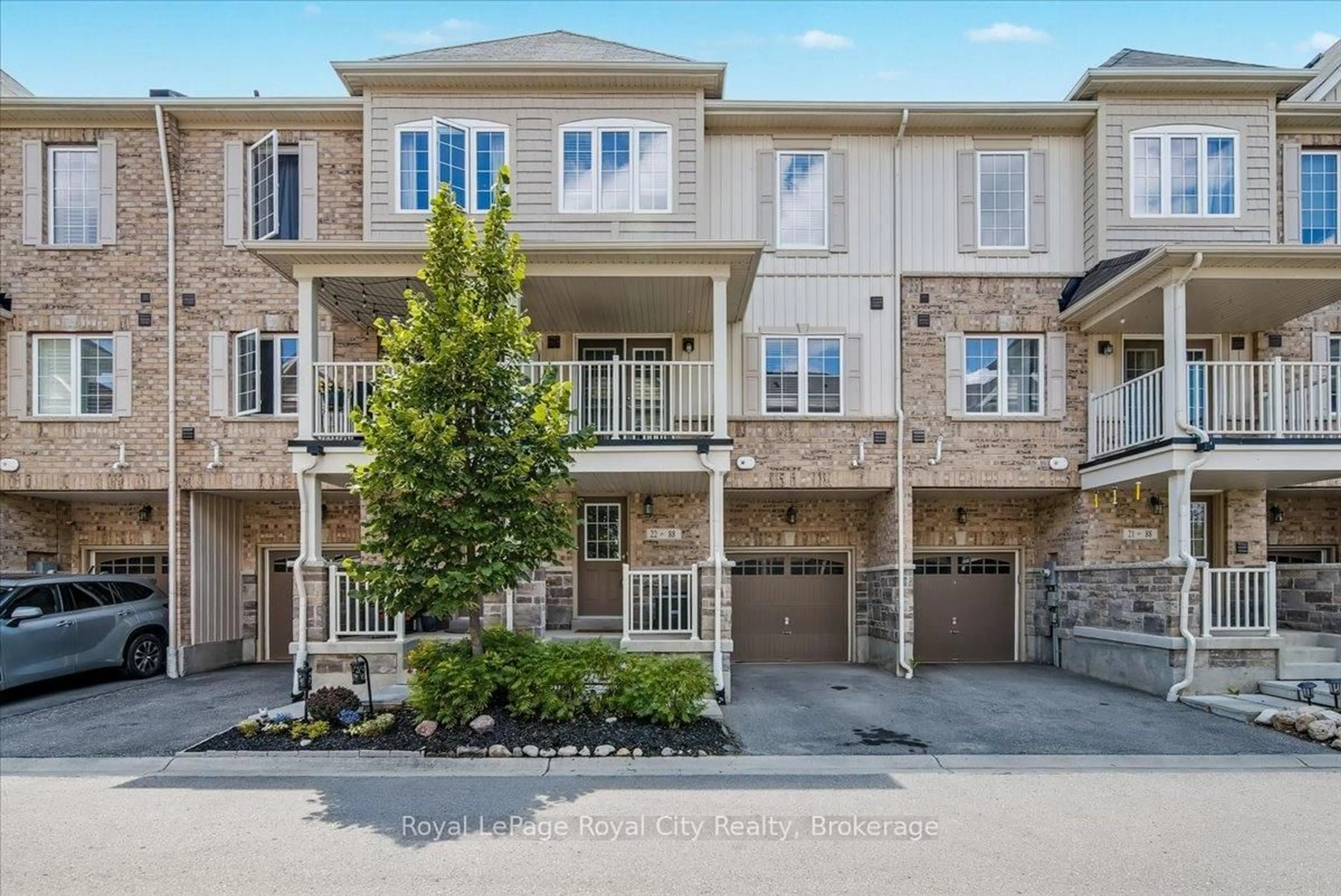 A pic from outside/outdoor area/front of a property/back of a property/a pic from drone, street for 88 Decorso Dr #22, Guelph Ontario N1L 0A9