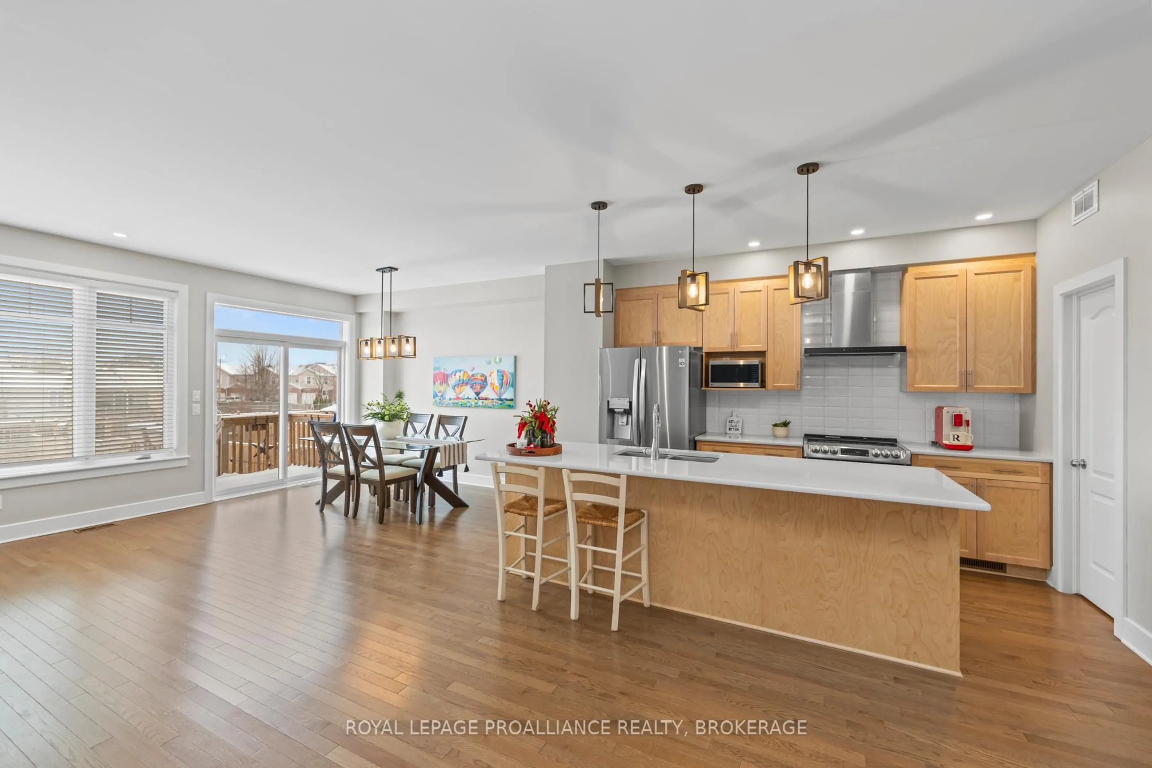 Open concept kitchen, wood/laminate floor for 1114 Barrow Ave, Kingston Ontario K7M 0G5