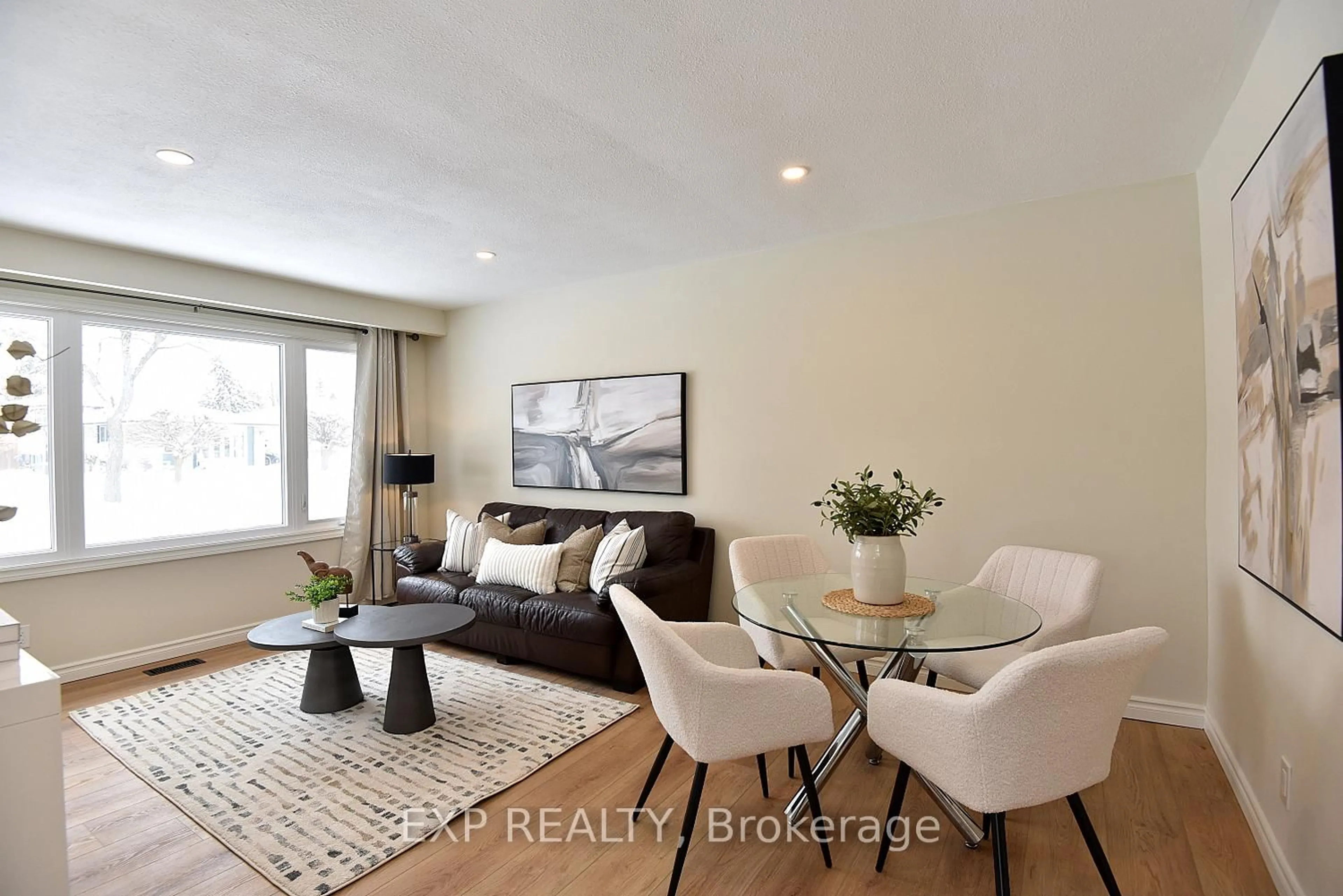 Living room with furniture, wood/laminate floor for 47 Odessa St, Hamilton Ontario L8J 1A3