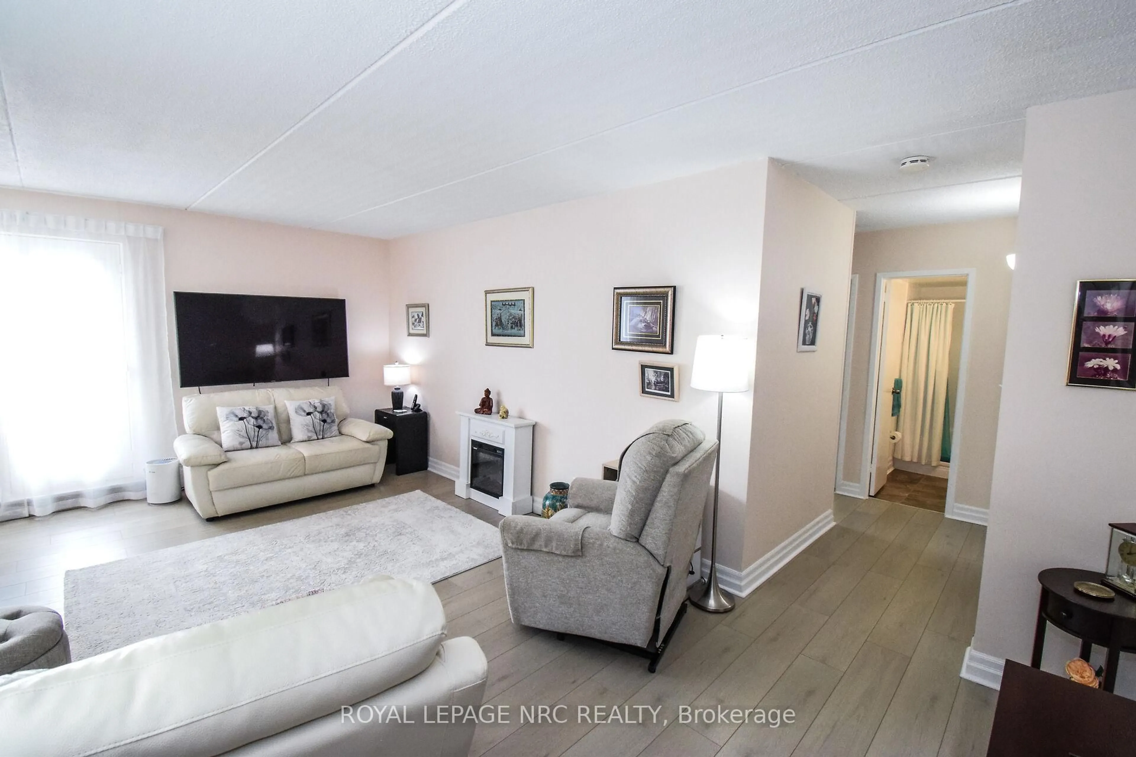 Living room with furniture, unknown for 198 Scott St #320, St. Catharines Ontario L2N 5T3