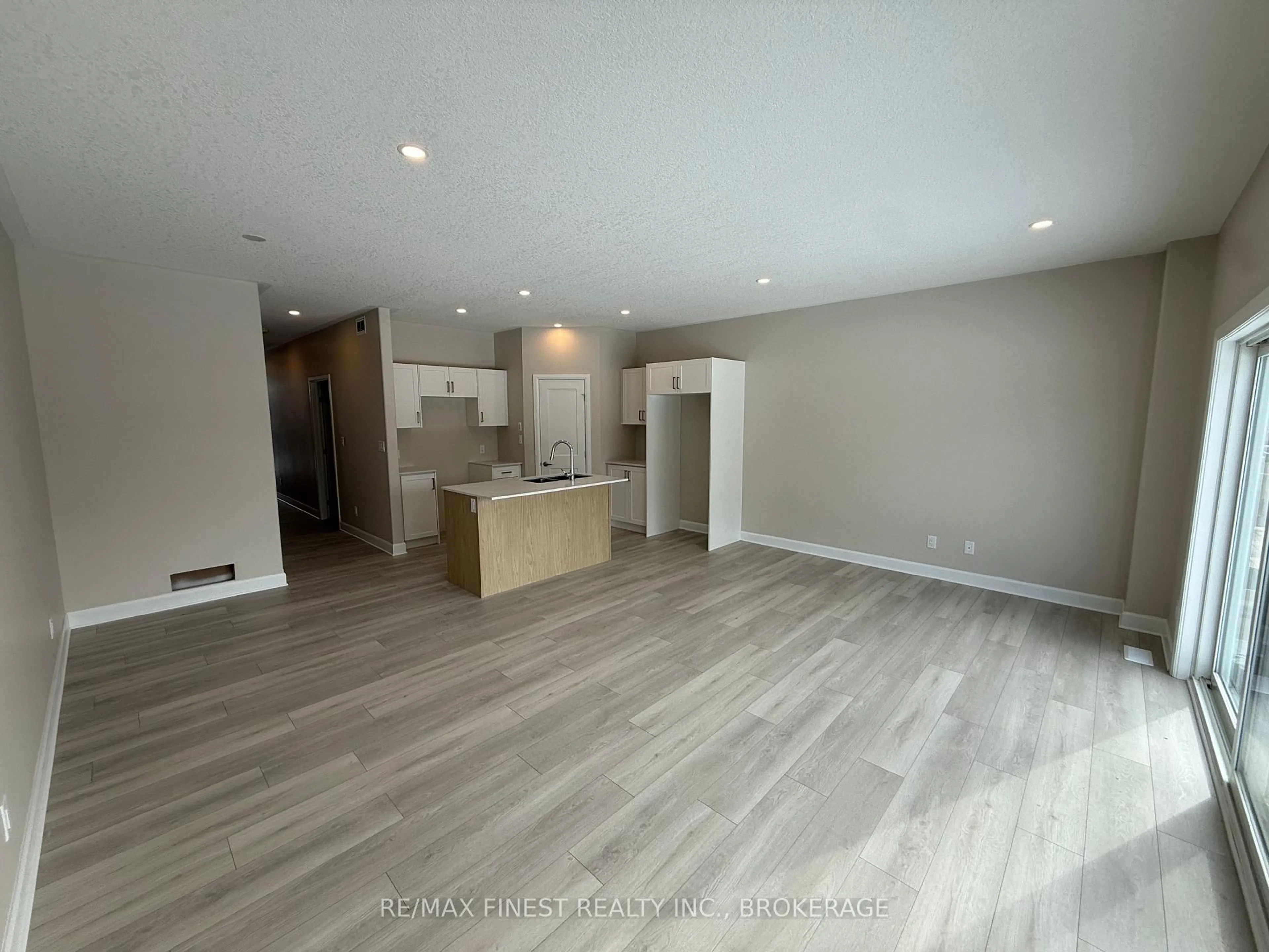 Open concept kitchen, wood/laminate floor for 193 HERITAGE PARK Dr, Greater Napanee Ontario K7R 3X8