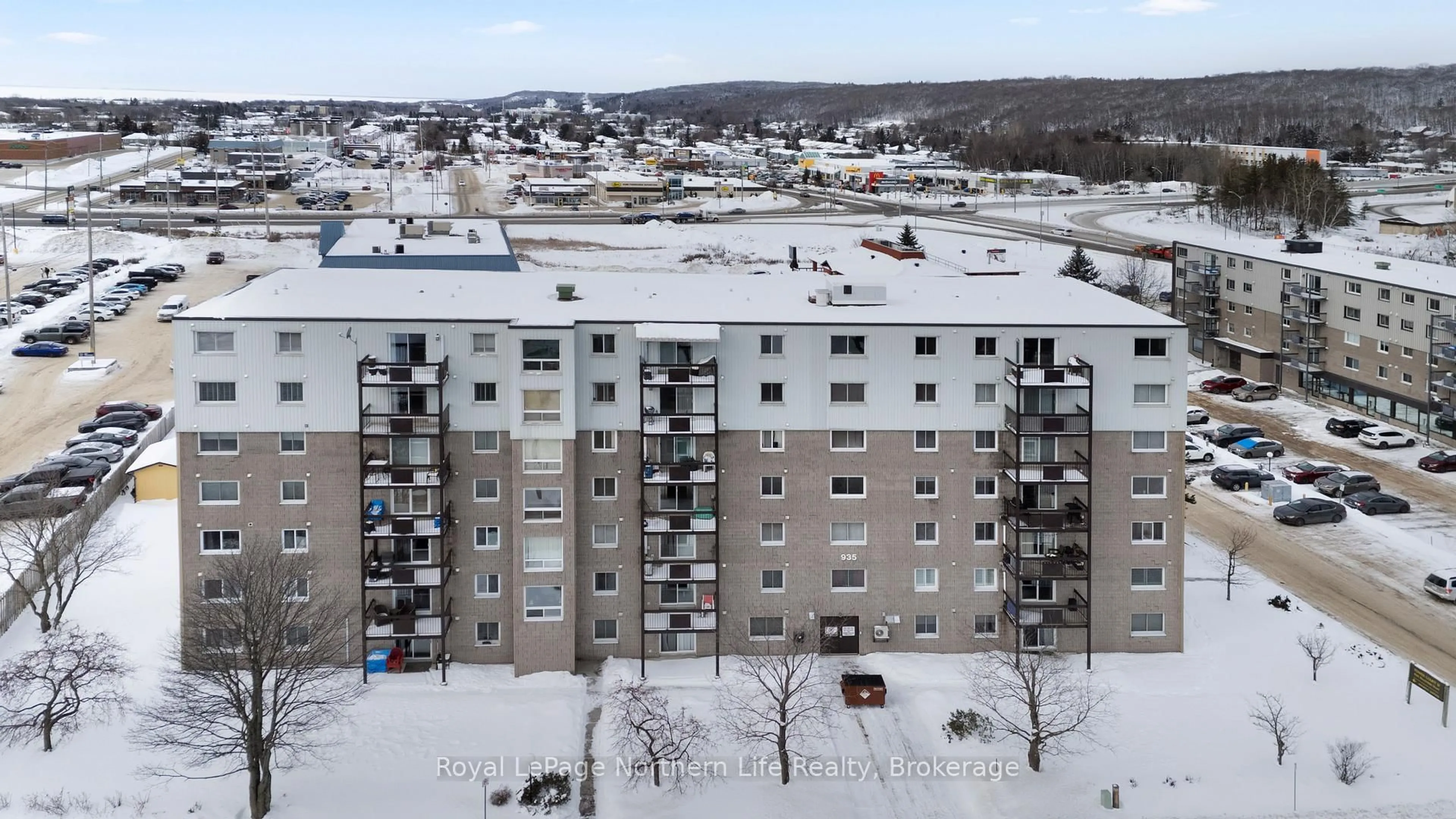 A pic from outside/outdoor area/front of a property/back of a property/a pic from drone, unknown for 935 Stockdale Rd #405, North Bay Ontario P1B 9L7