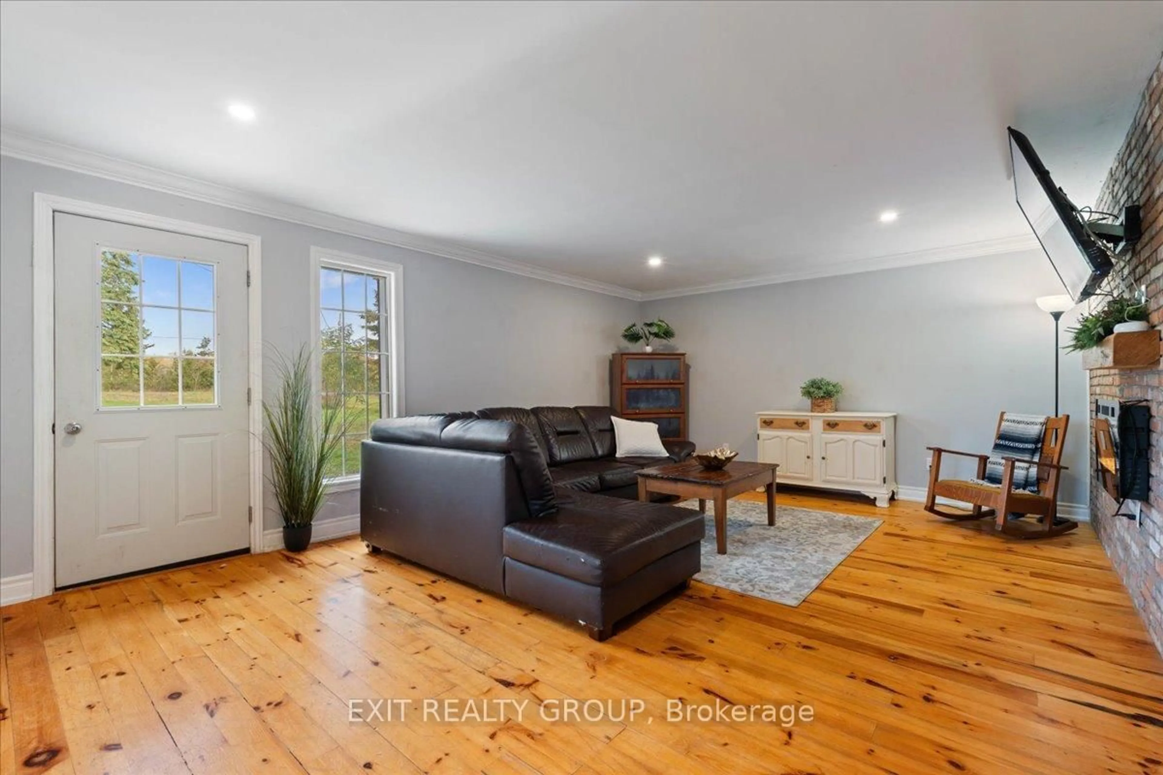 Living room with furniture, wood/laminate floor for 895 English Settlement Rd, Trenton Ontario K8V 5P7