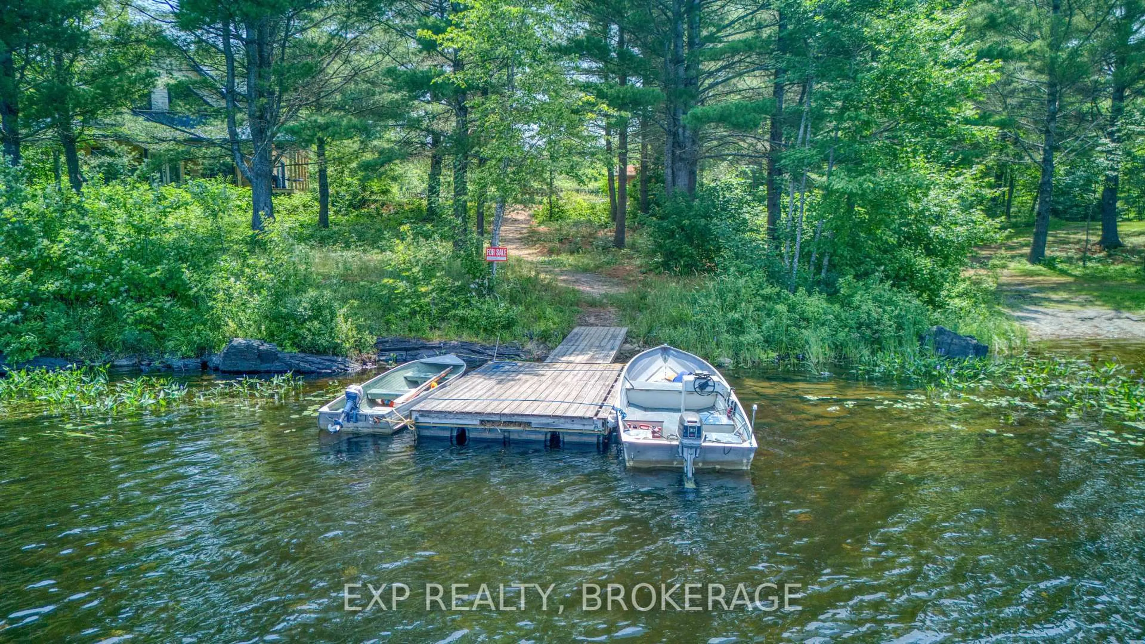 A pic from outside/outdoor area/front of a property/back of a property/a pic from drone, water/lake/river/ocean view for 1249 WATERS EDGE Lane, Arden Ontario K0H 1B0