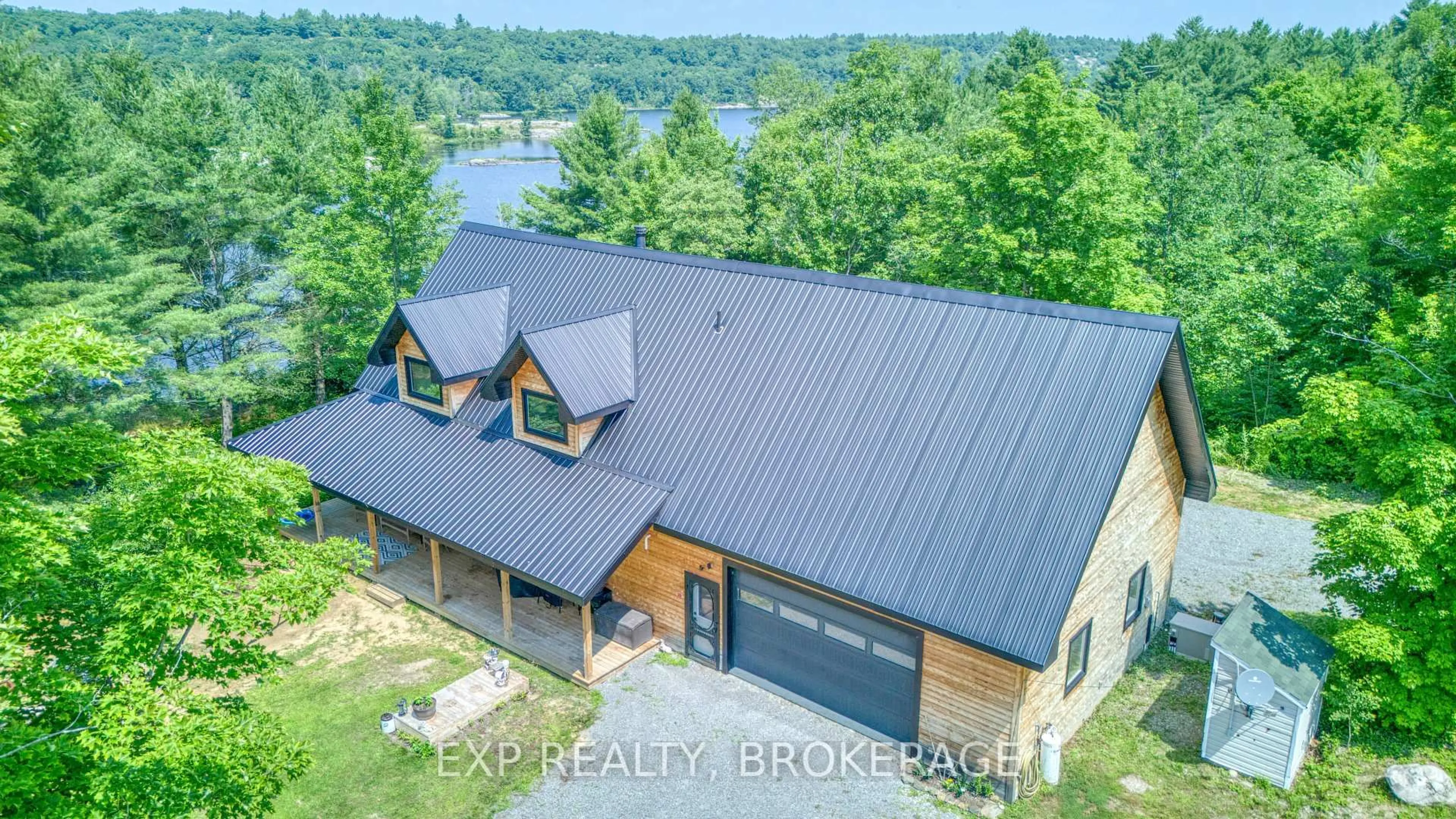 A pic from outside/outdoor area/front of a property/back of a property/a pic from drone, water/lake/river/ocean view for 1249 WATERS EDGE Lane, Arden Ontario K0H 1B0
