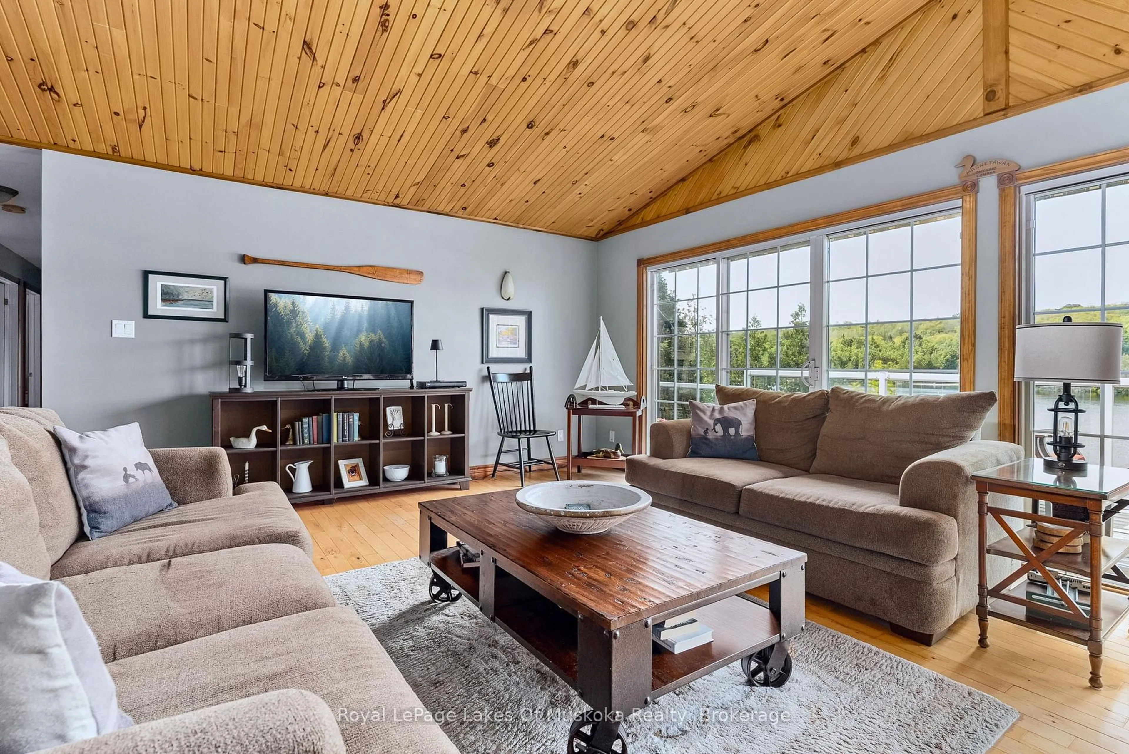 Living room with furniture, wood/laminate floor for 300 Wurm Rd, Magnetawan Ontario P0A 1P0