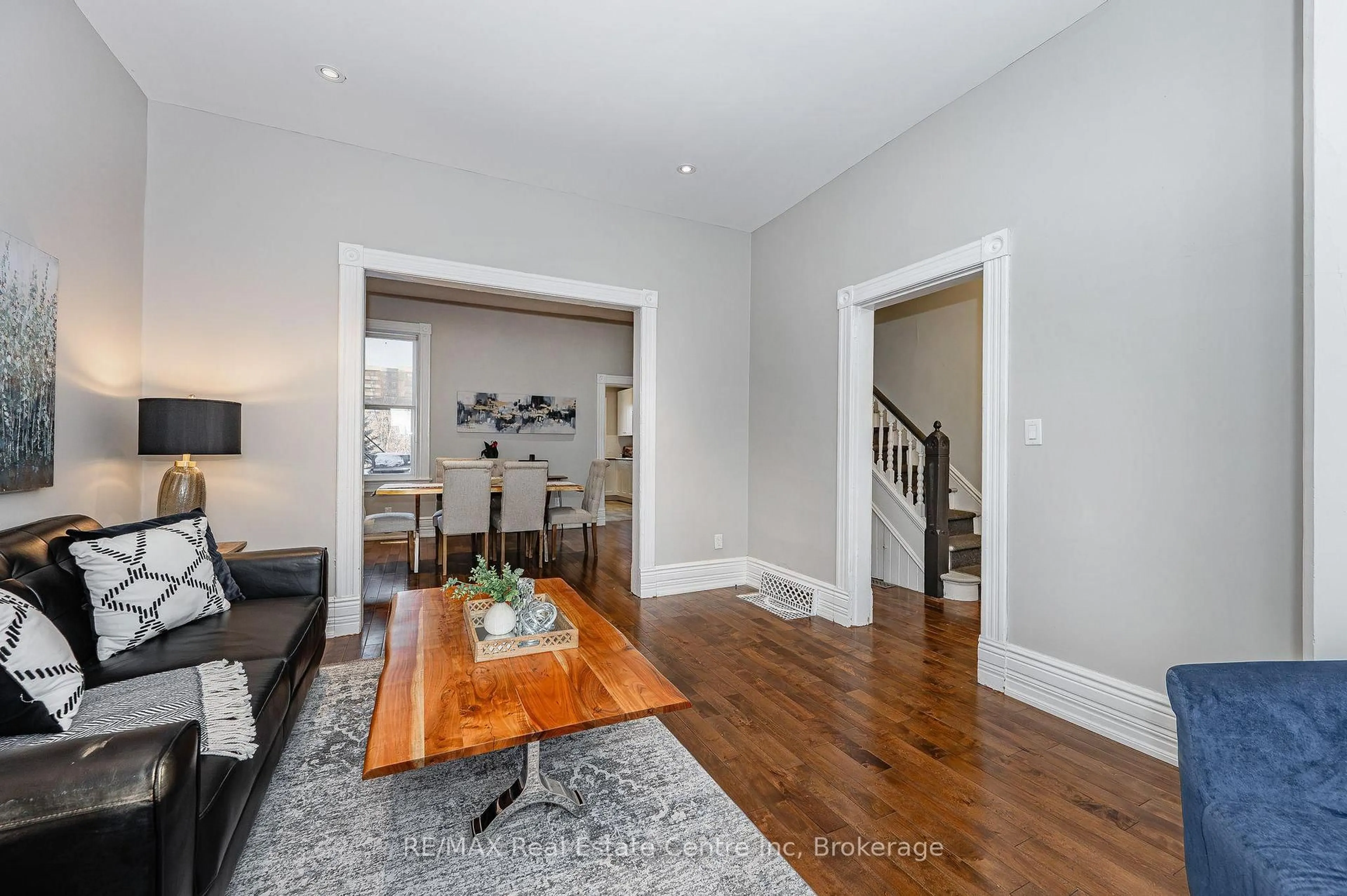 Living room with furniture, wood/laminate floor for 103 Surrey St, Guelph Ontario N1H 3P7