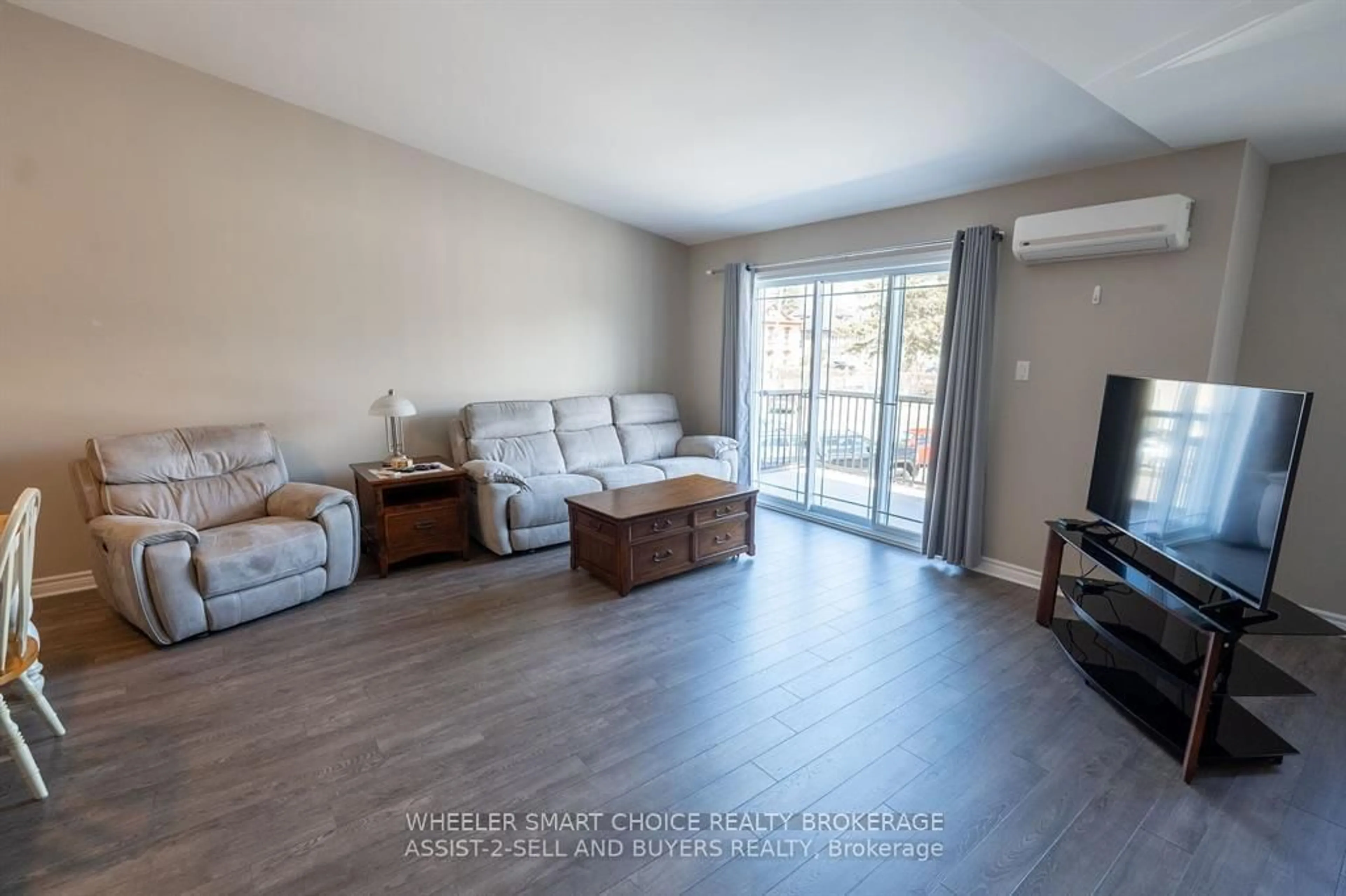 Living room with furniture, wood/laminate floor for 218 First St #225, Cornwall Ontario K6H 0G2