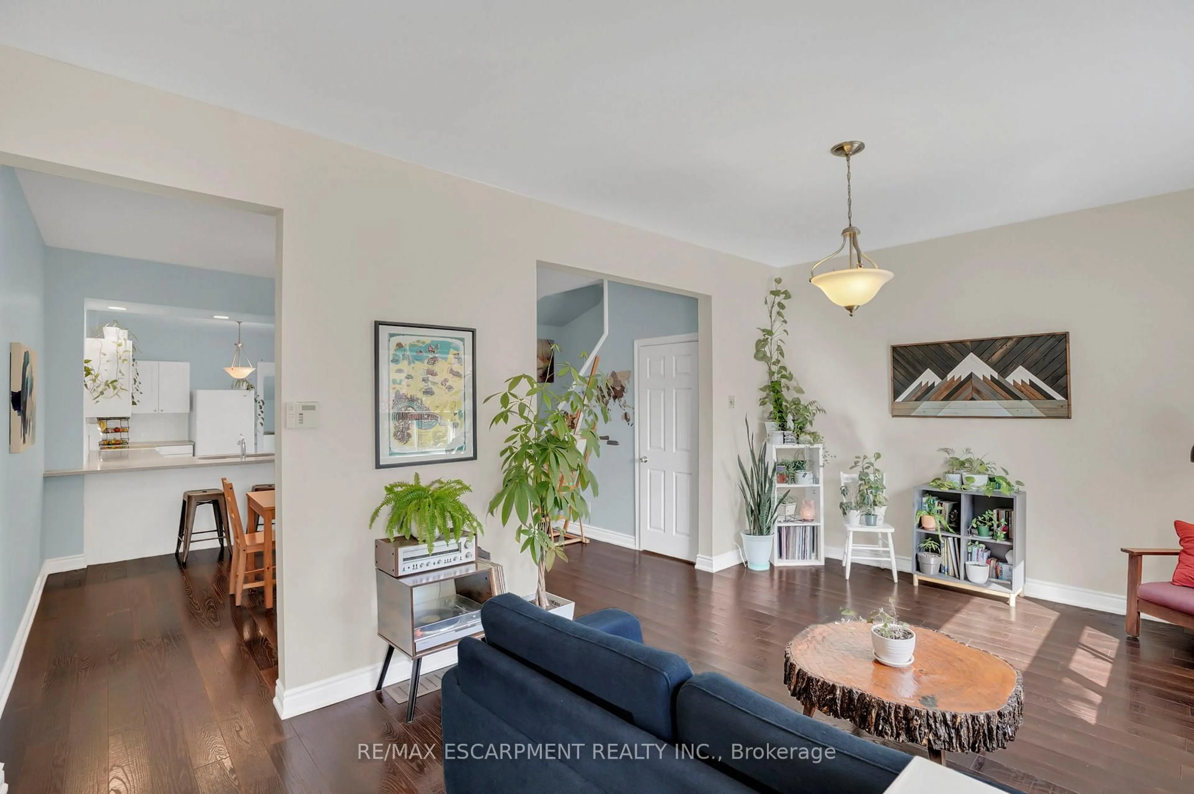 Living room with furniture, wood/laminate floor for 22 Liberty St, Hamilton Ontario L8N 2N6