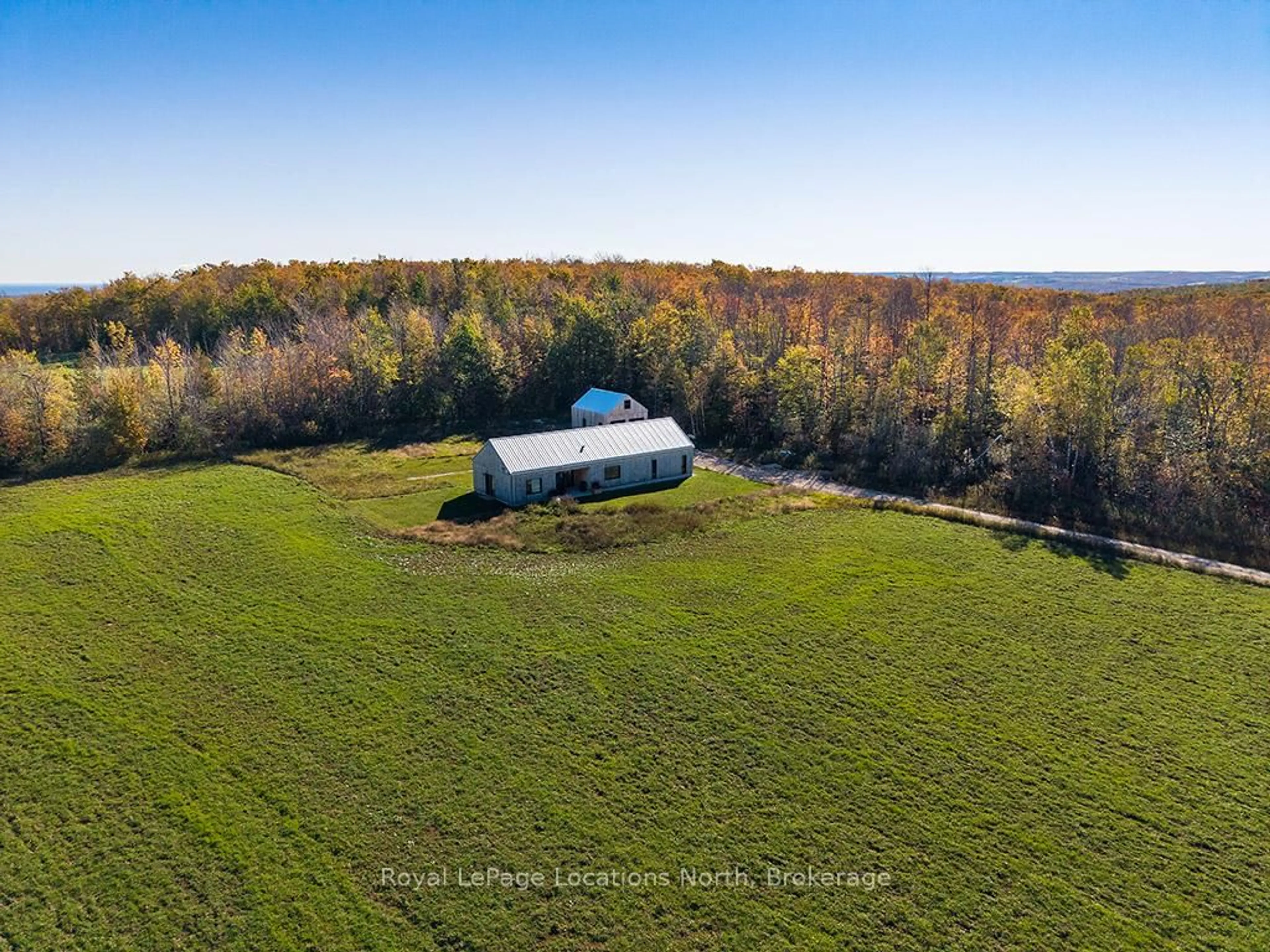 A pic from outside/outdoor area/front of a property/back of a property/a pic from drone, unknown for 58165 12th Line, Meaford Ontario N4L 1W5