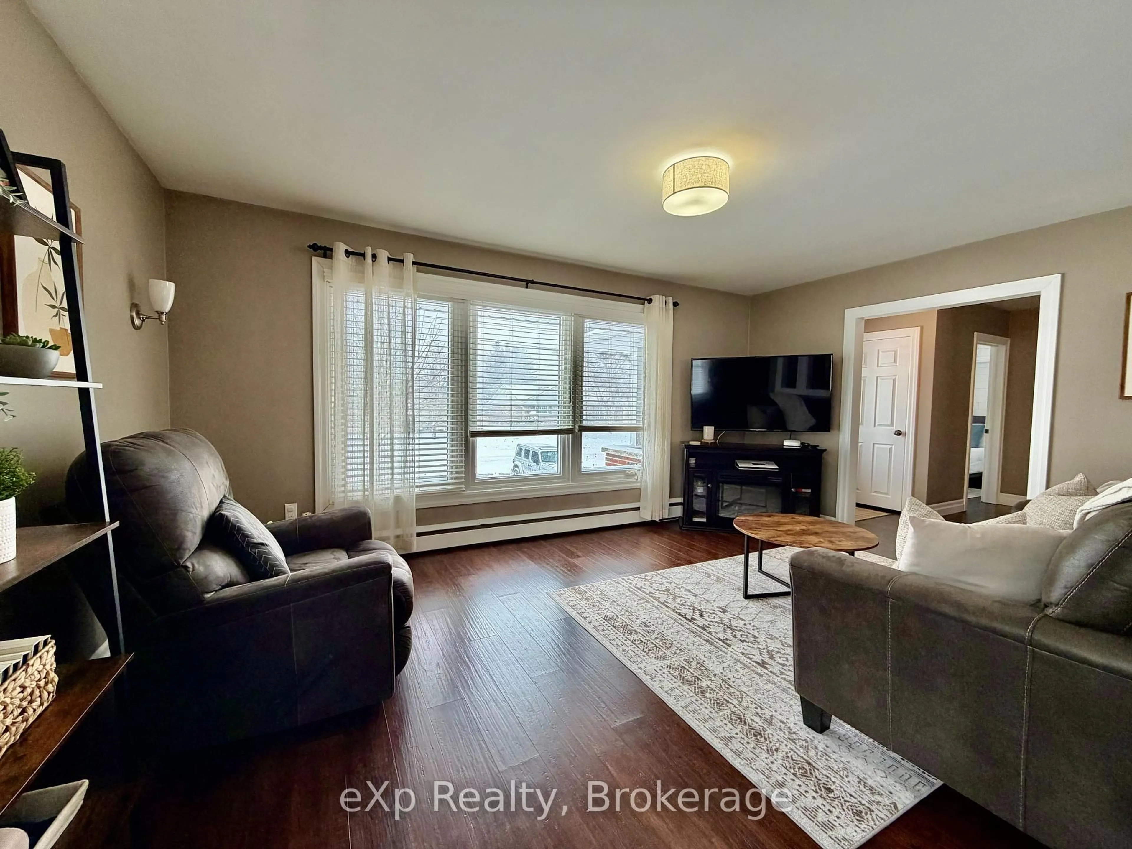 Living room with furniture, wood/laminate floor for 13 BROWNS Ave, Brockton Ontario N0G 2V0