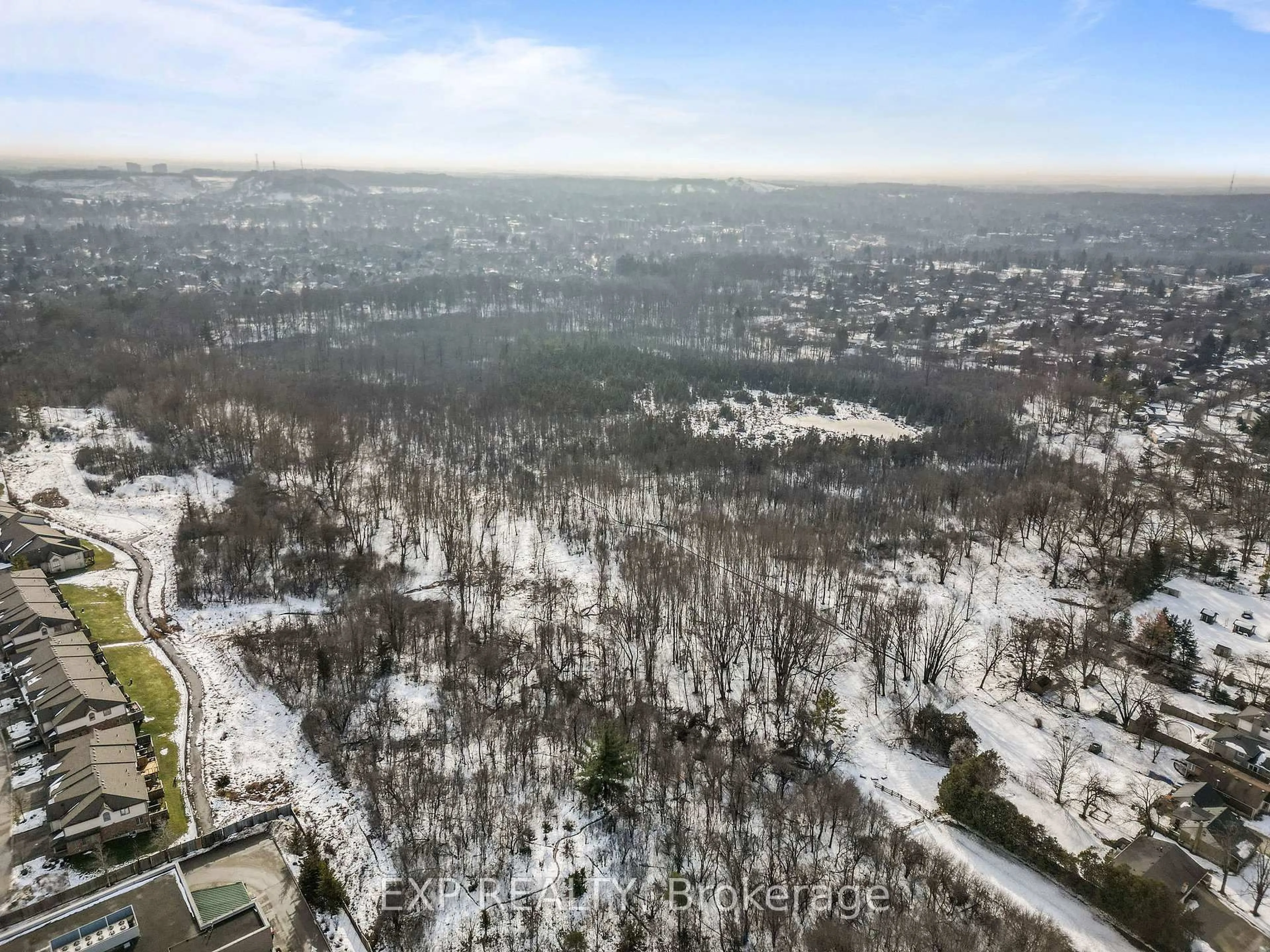 A pic from outside/outdoor area/front of a property/back of a property/a pic from drone, forest/trees view for 600 Hyde Park Rd #223, London North Ontario N6H 5W8
