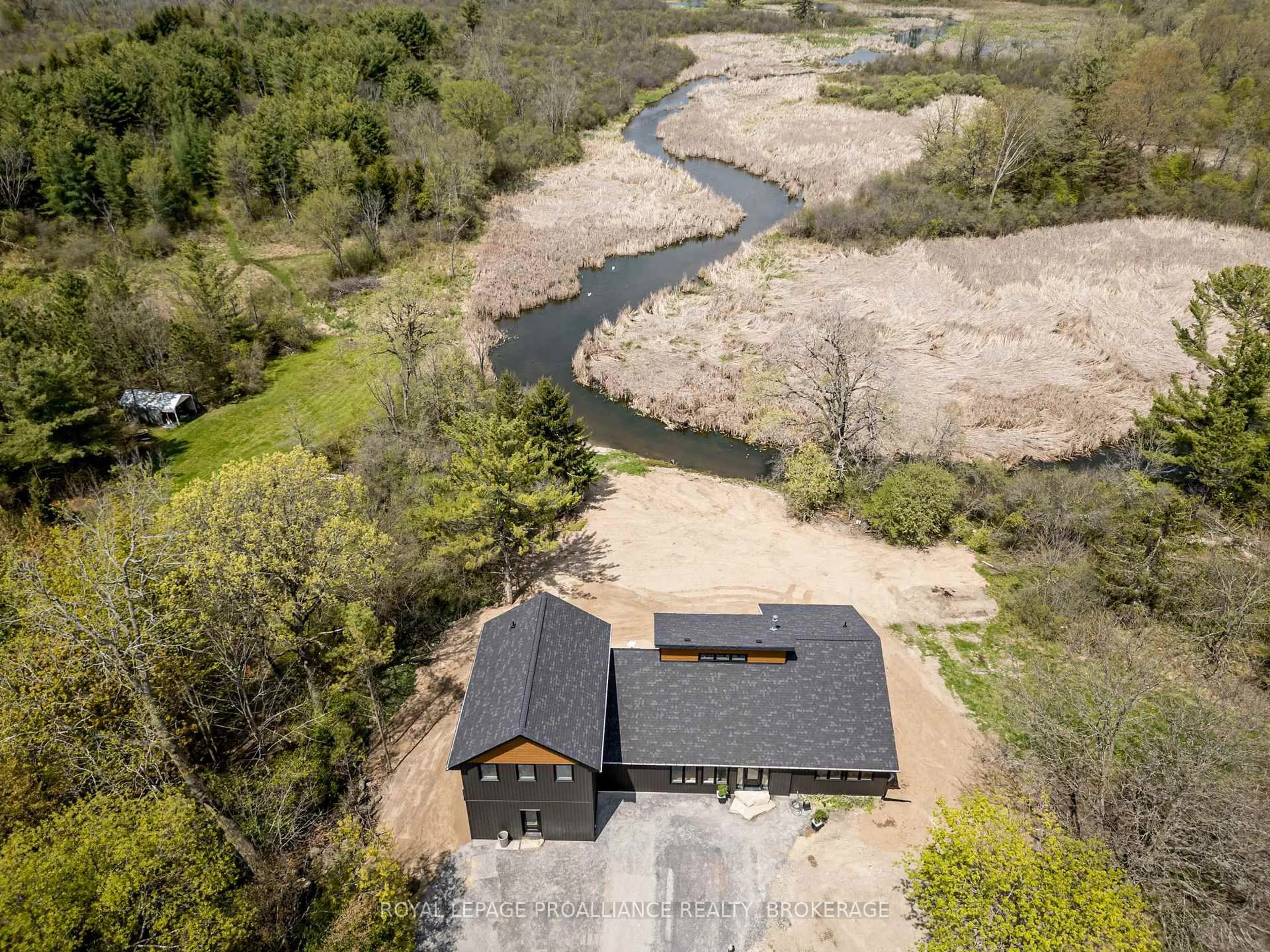 A pic from outside/outdoor area/front of a property/back of a property/a pic from drone, water/lake/river/ocean view for 2924 Highway 2, Kingston Ontario K7L 4V1