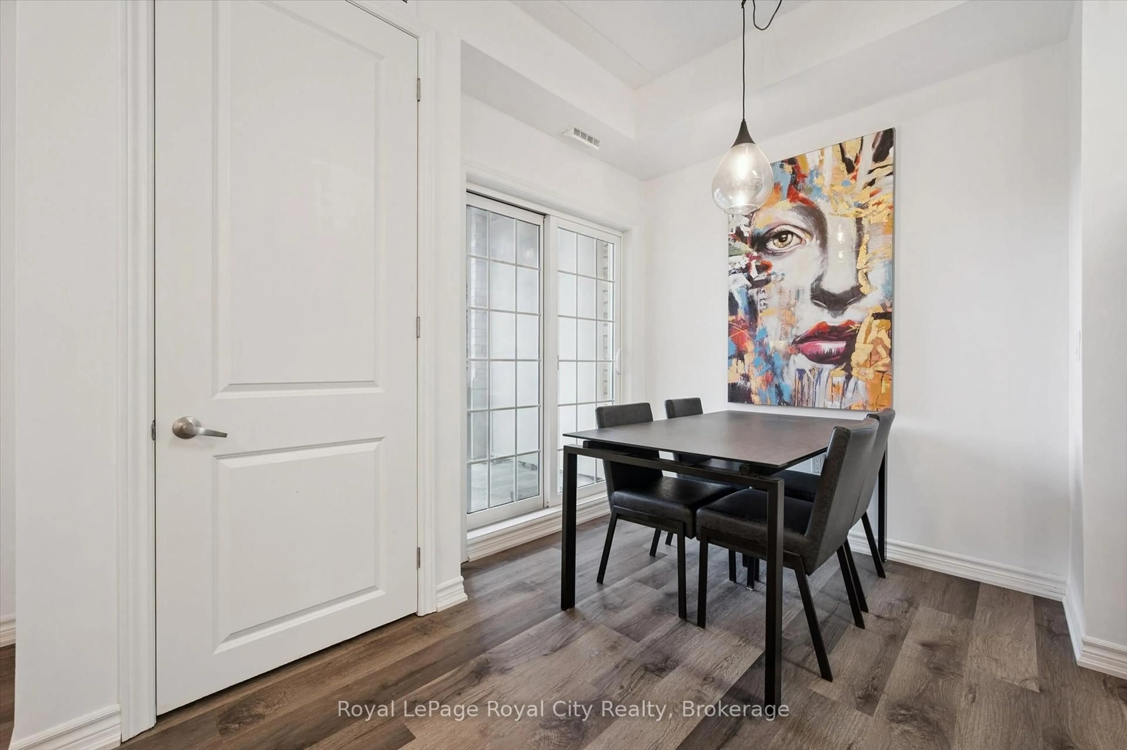 Dining room, wood/laminate floor for 1077 Gordon St #228, Guelph Ontario N1G 0E3