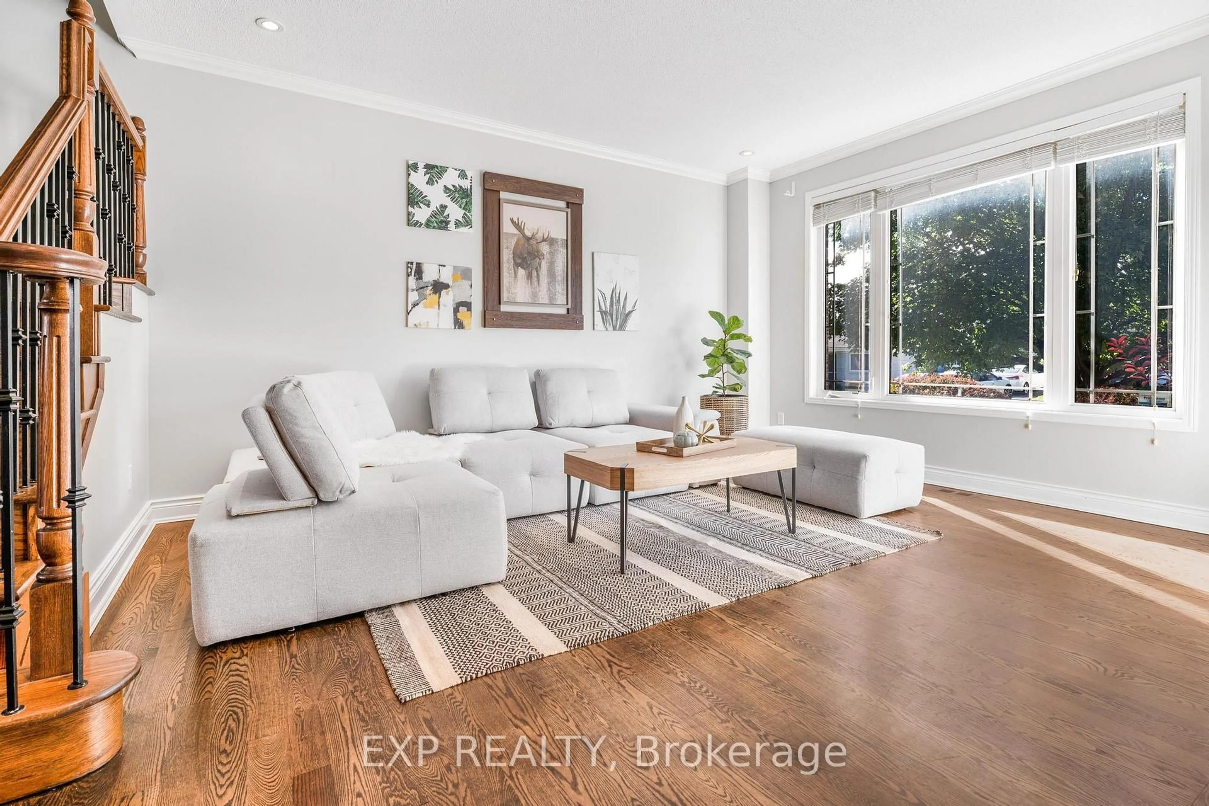 Living room with furniture, wood/laminate floor for 1157 Elmlea Dr, Gloucester Ontario K1J 6W1