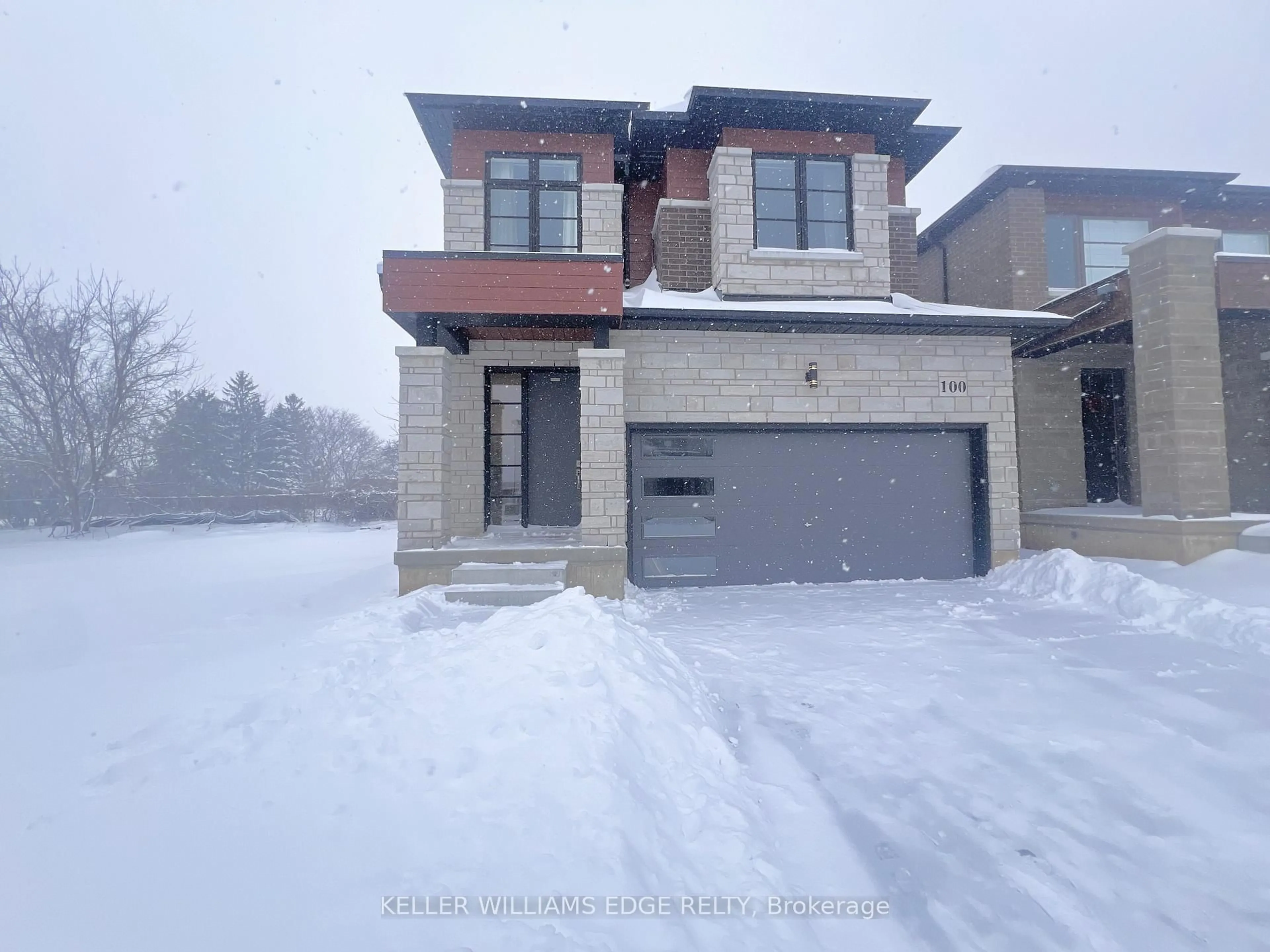 Home with brick exterior material, street for 100 Shady Oaks Tr, Hamilton Ontario L9B 0K6